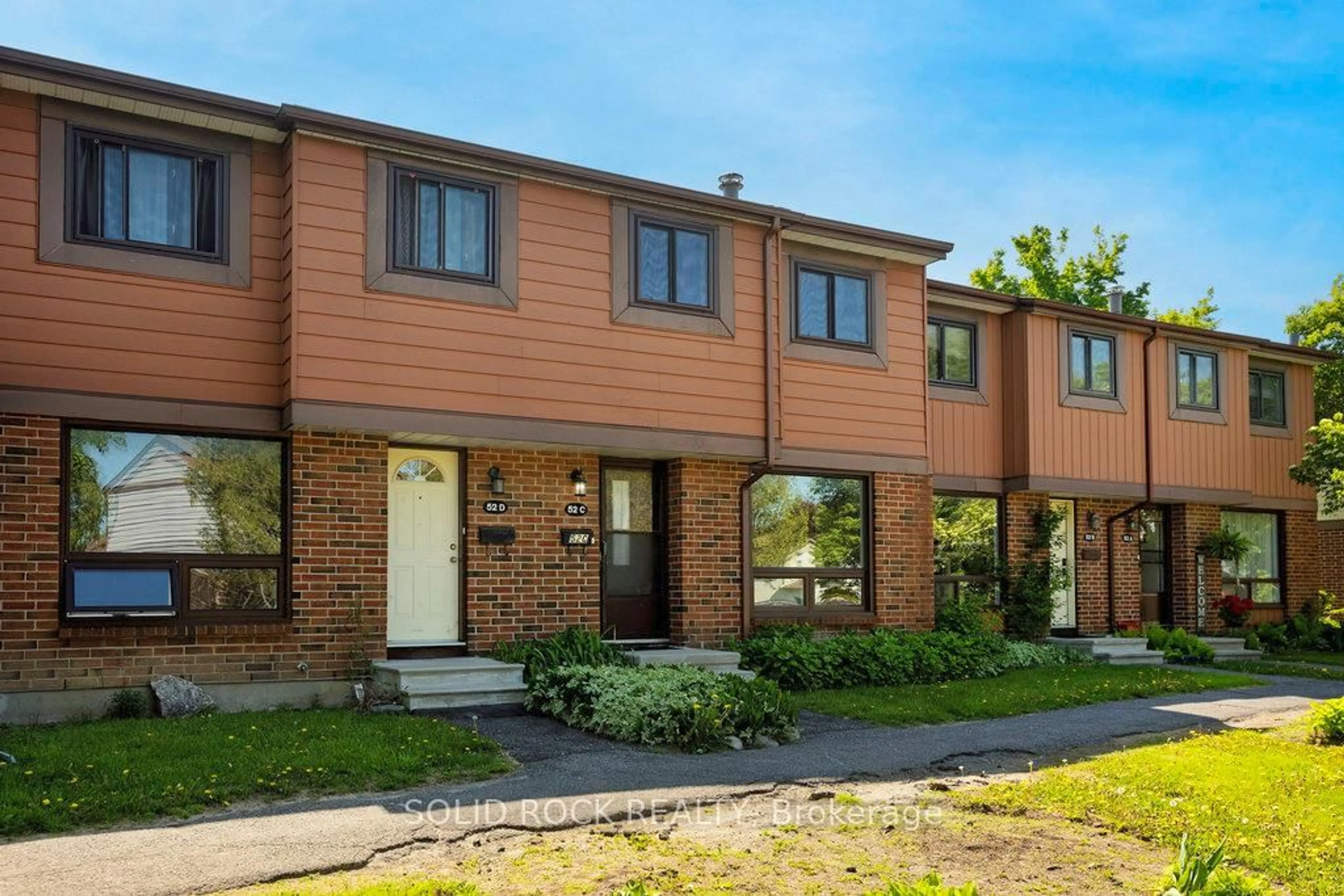Home with brick exterior material, street for 52C Foxfield Dr #3, Ottawa Ontario K2J 1P7