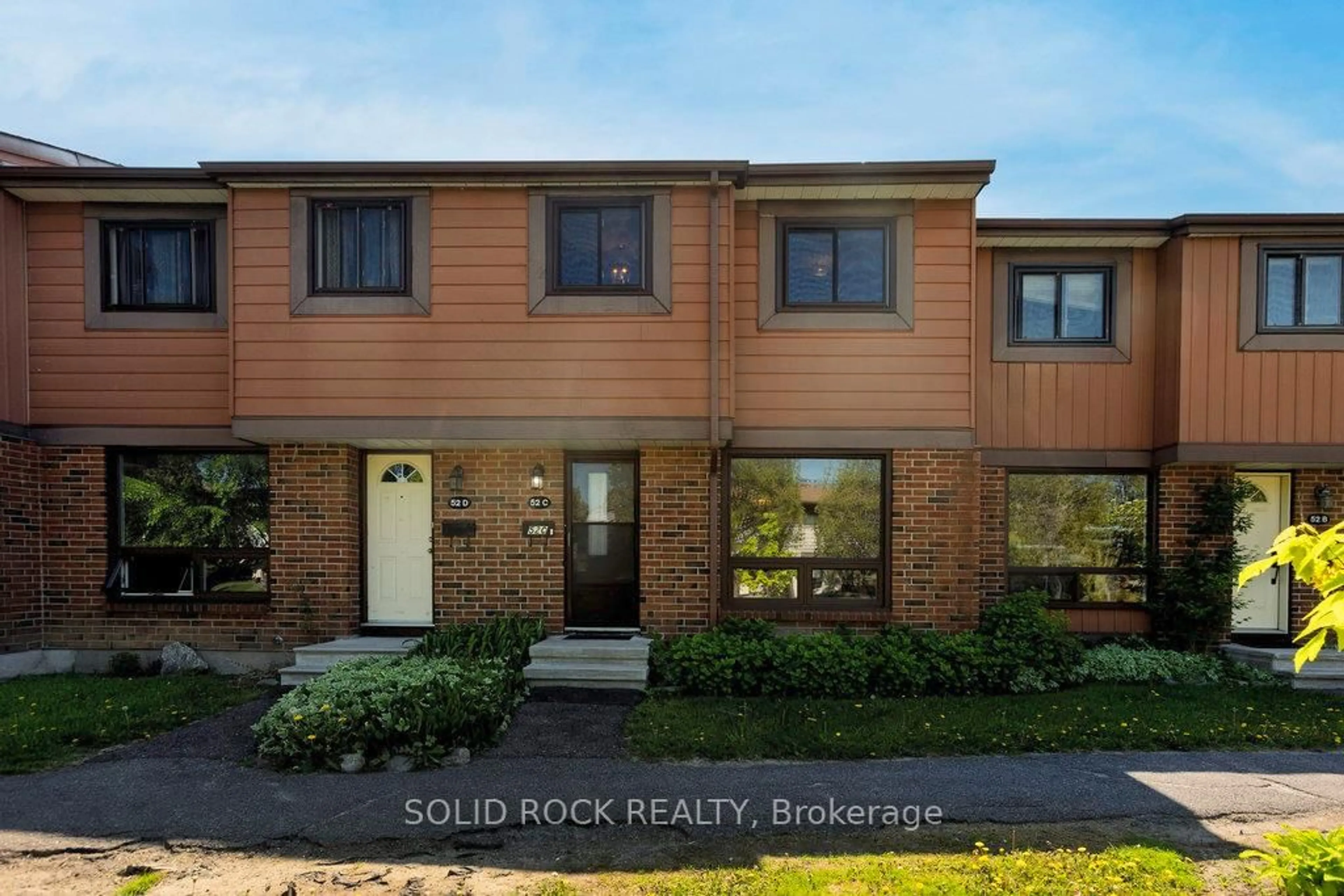 Home with brick exterior material, street for 52C Foxfield Dr #3, Ottawa Ontario K2J 1P7