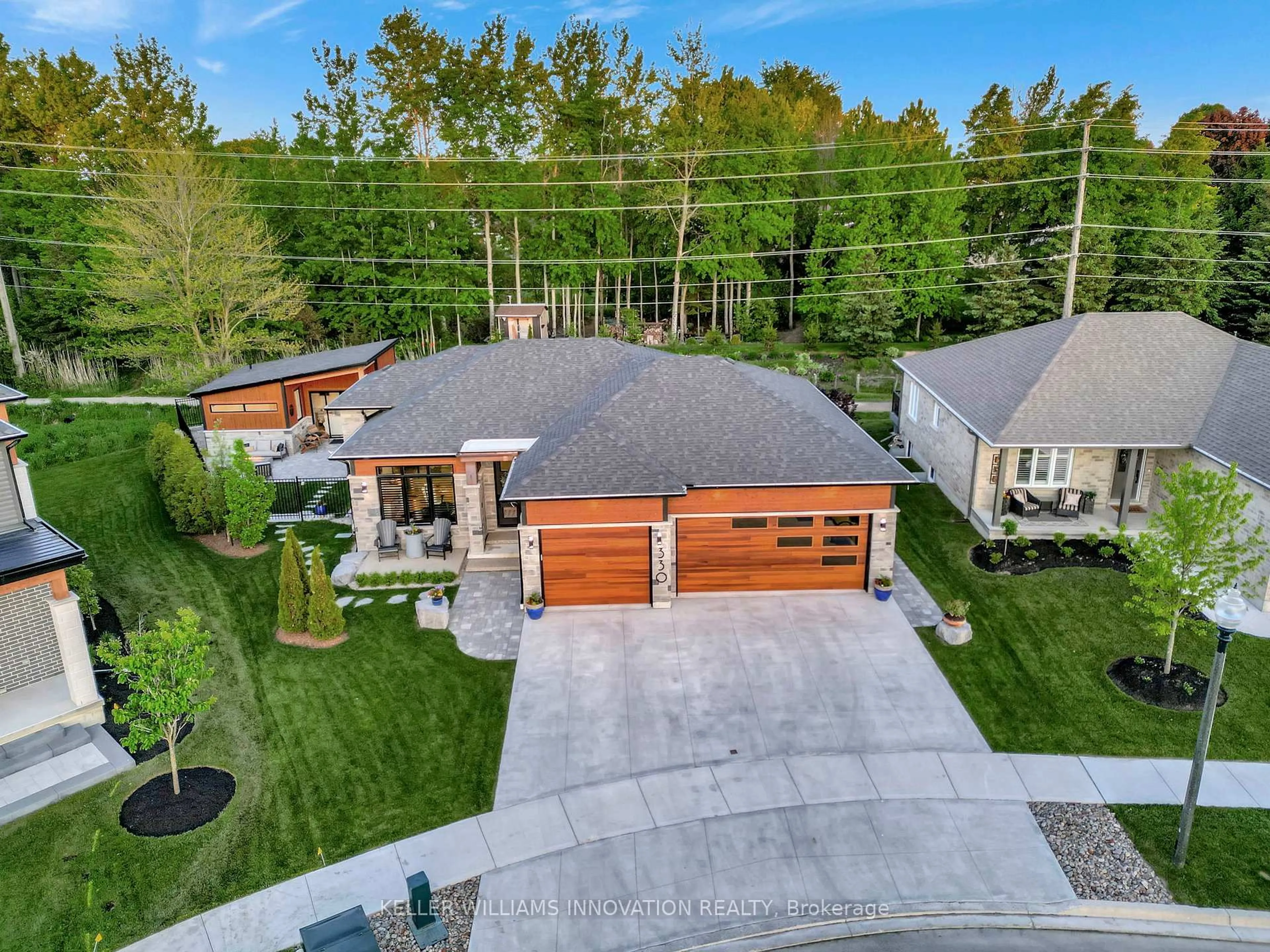 A pic from outside/outdoor area/front of a property/back of a property/a pic from drone, street for 330 Rogers Rd, North Perth Ontario N0G 1Y0