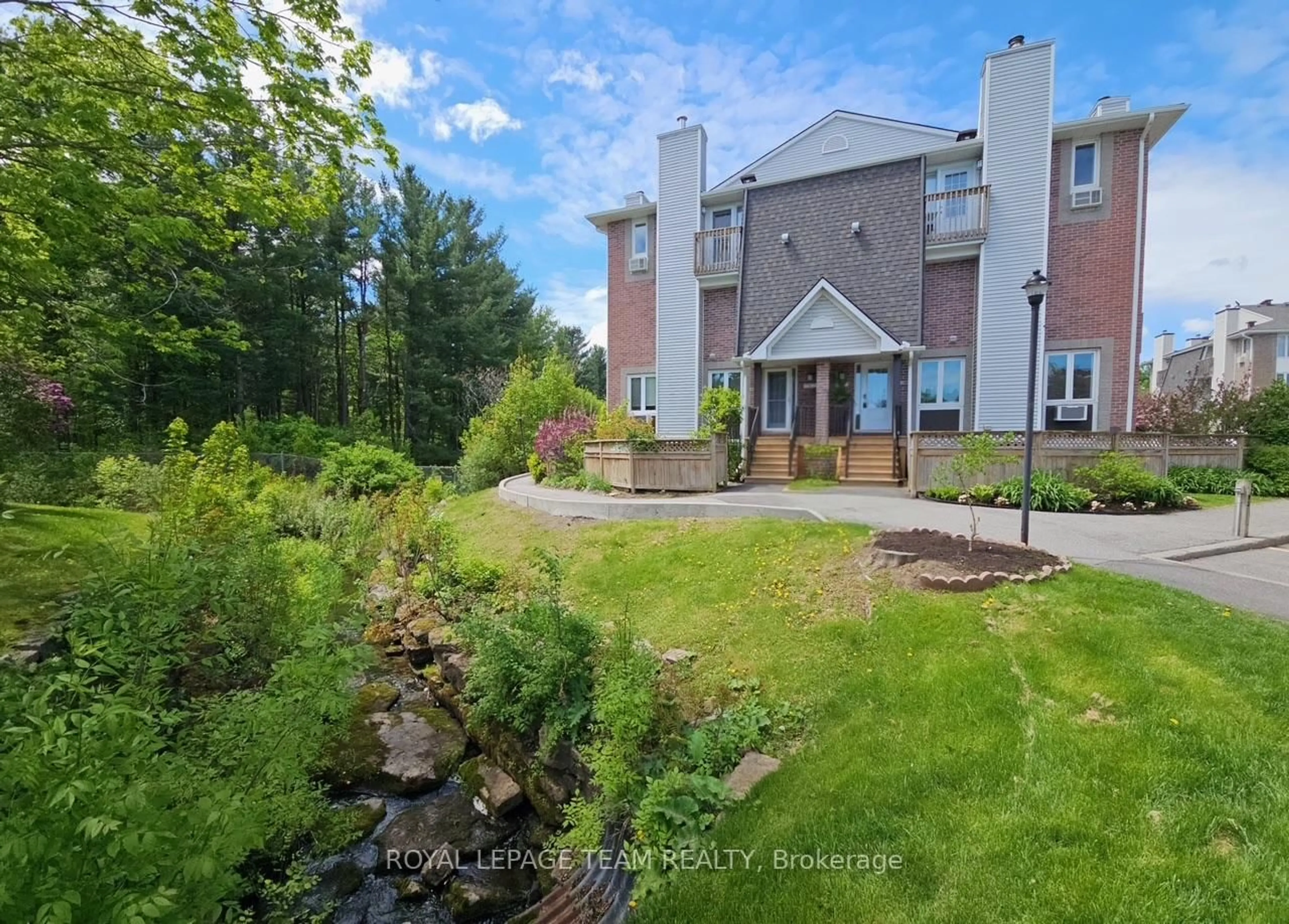A pic from outside/outdoor area/front of a property/back of a property/a pic from drone, water/lake/river/ocean view for 5 Timberview Way #5, Ottawa Ontario K2H 9M6