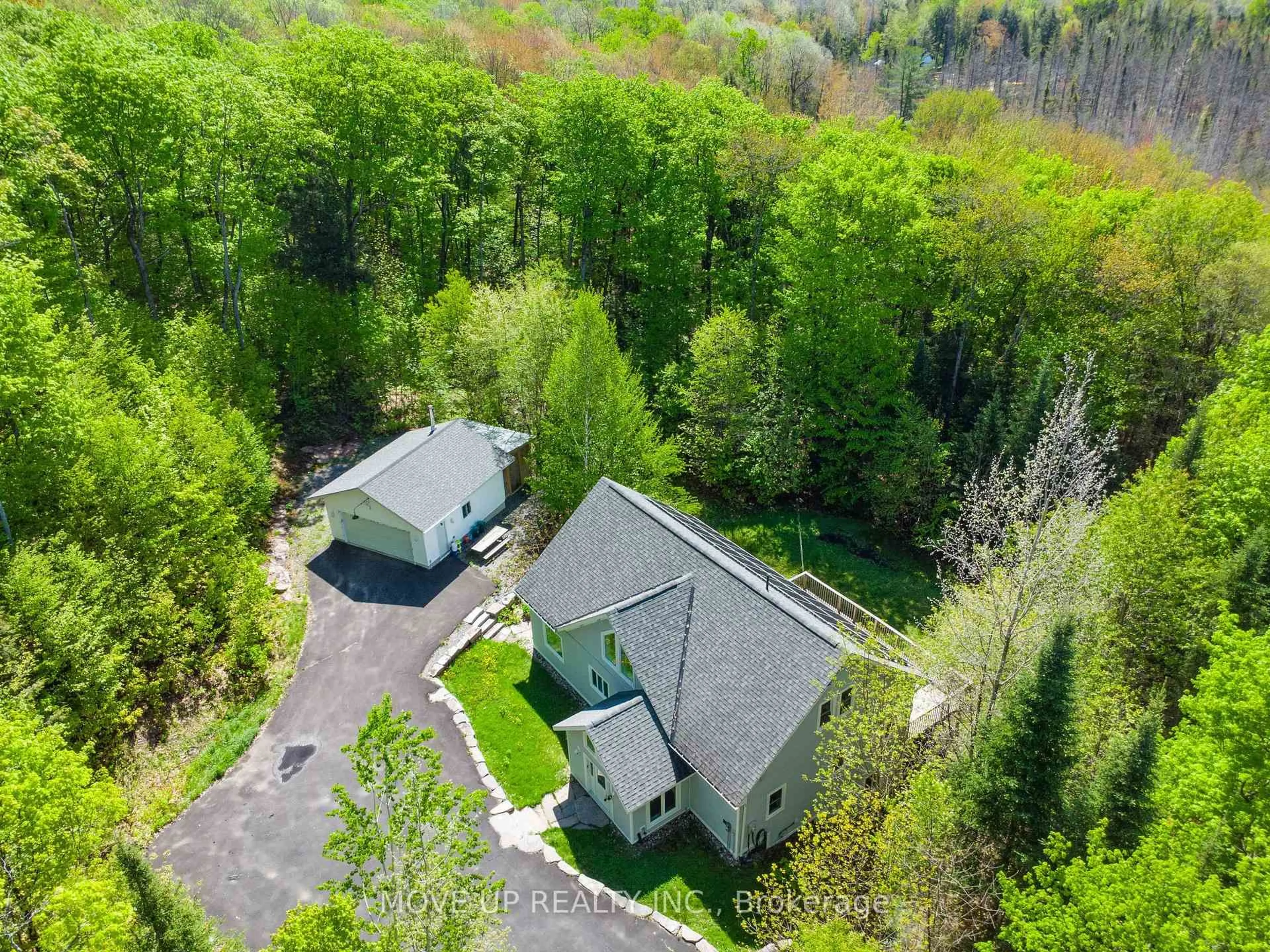 A pic from outside/outdoor area/front of a property/back of a property/a pic from drone, forest/trees view for 1884 BRUNEL Rd, Huntsville Ontario P1H 2J3