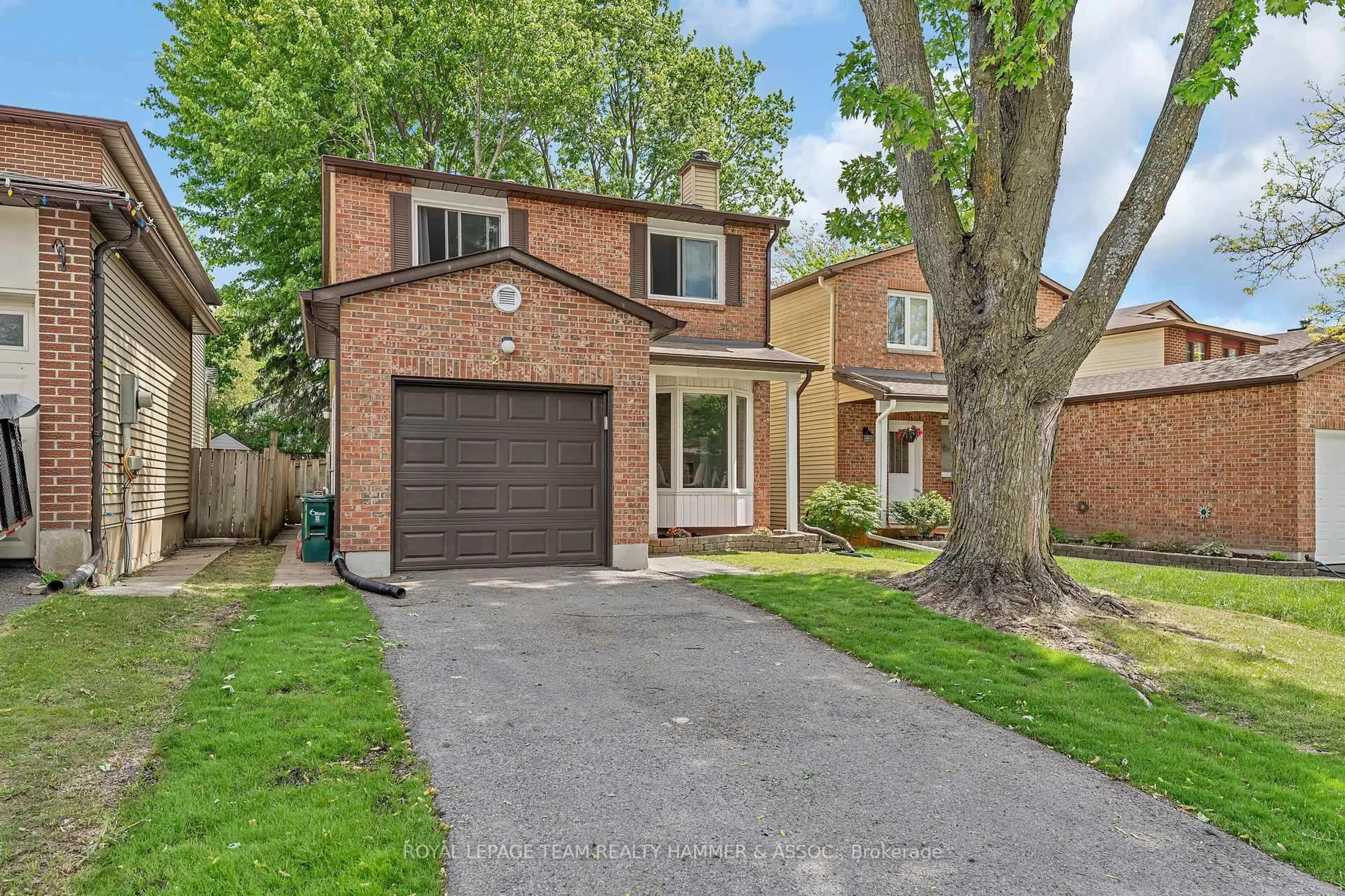 Home with brick exterior material, street for 217 Equestrian Dr, Ottawa Ontario K2M 1A5