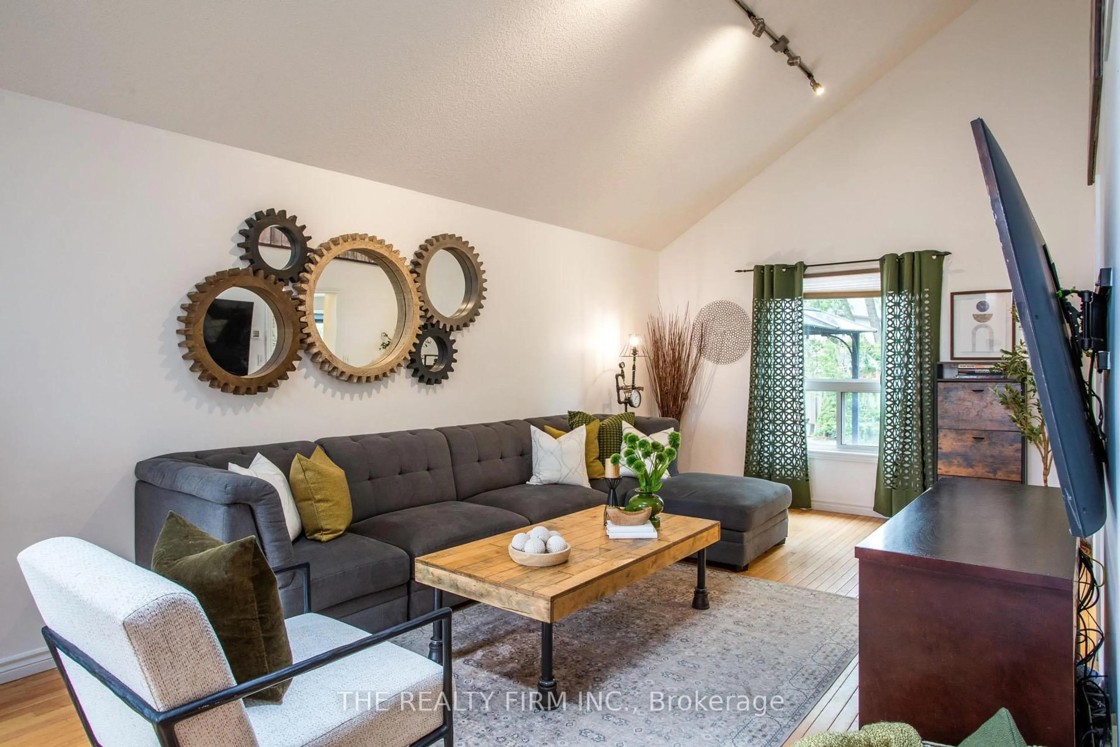 Living room with furniture, wood/laminate floor for 341 Cardigan Crt, London South Ontario N6M 1J7