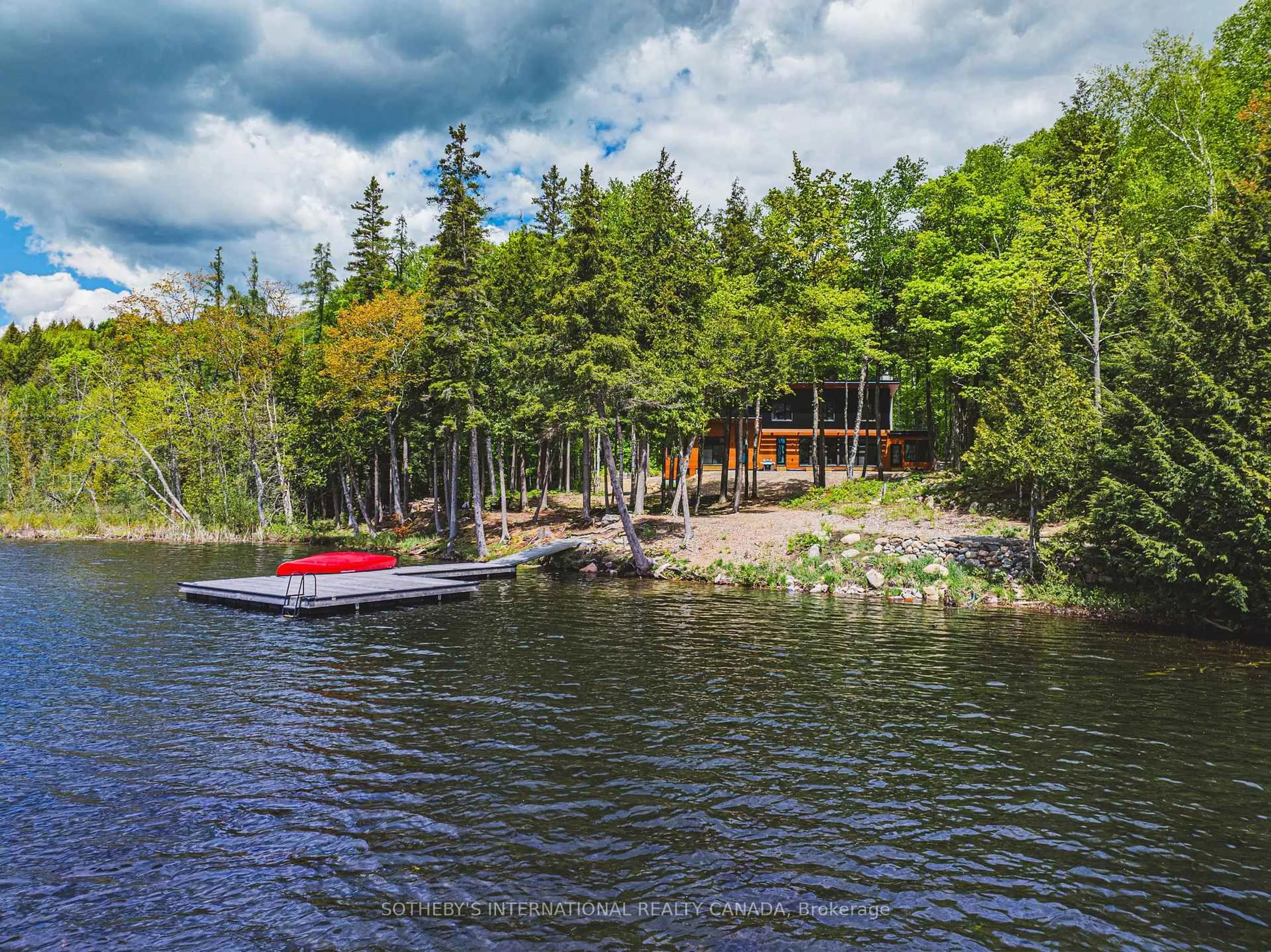 A pic from outside/outdoor area/front of a property/back of a property/a pic from drone, water/lake/river/ocean view for 21 Luke Lane, North Kawartha Ontario K0L 1A0