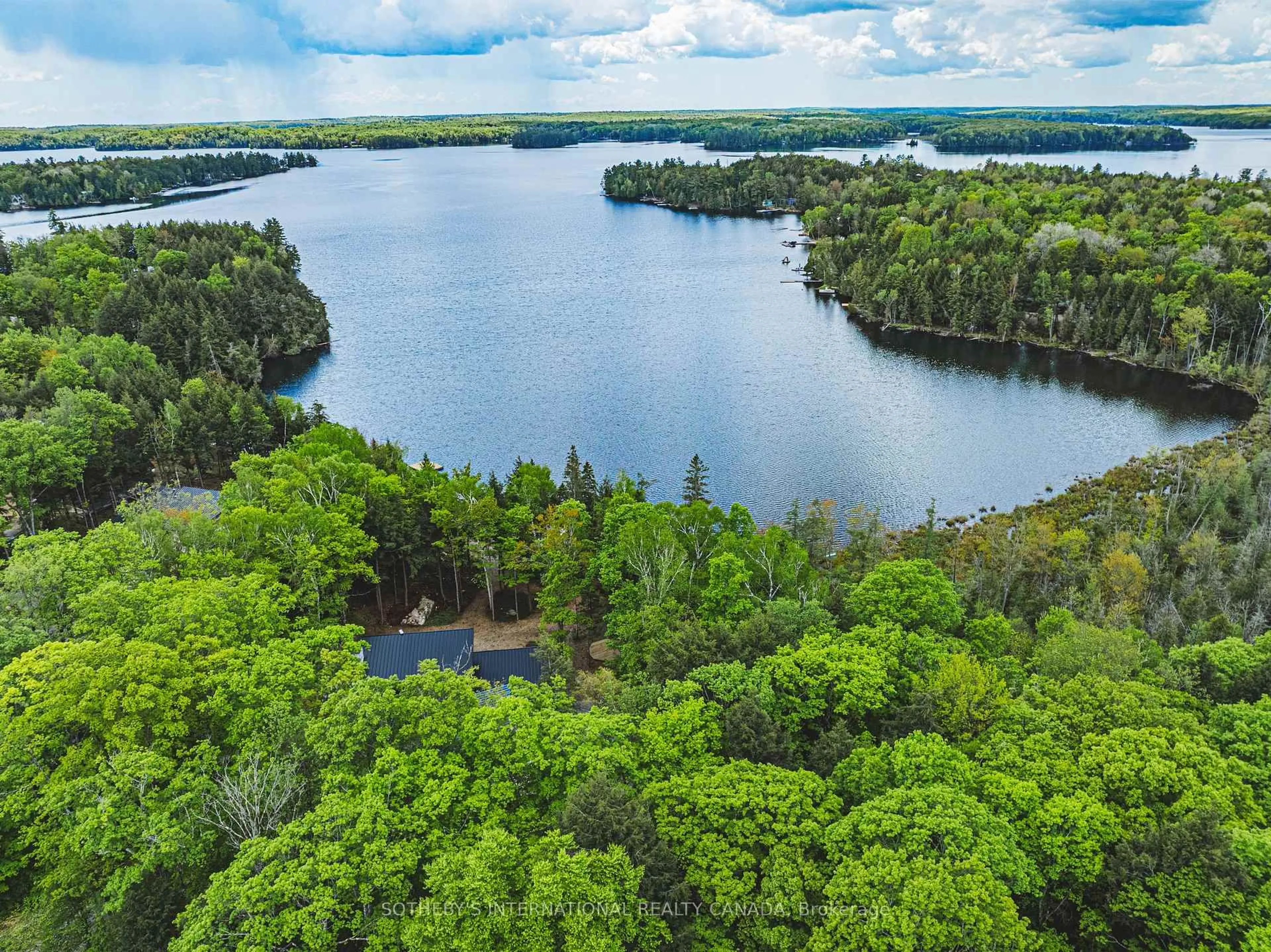 A pic from outside/outdoor area/front of a property/back of a property/a pic from drone, water/lake/river/ocean view for 21 Luke Lane, North Kawartha Ontario K0L 1A0