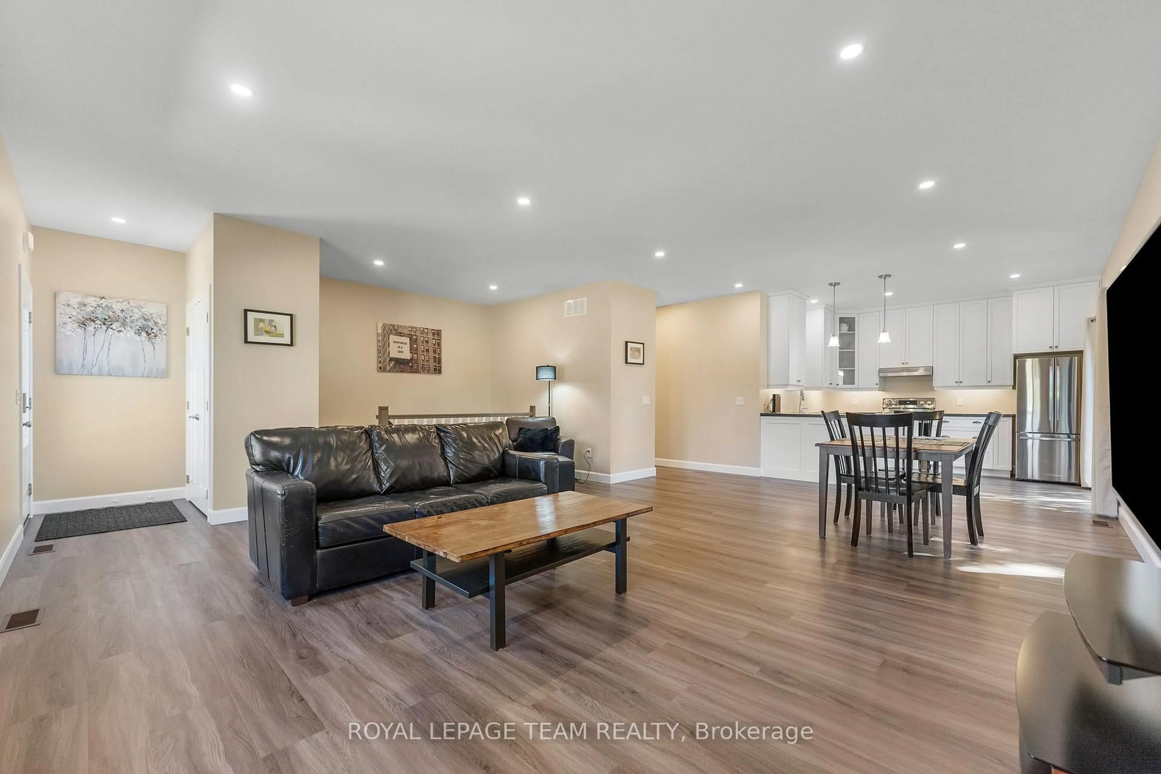 Living room with furniture, wood/laminate floor for 12 Simpson St, Cobden Ontario K0J 1K0