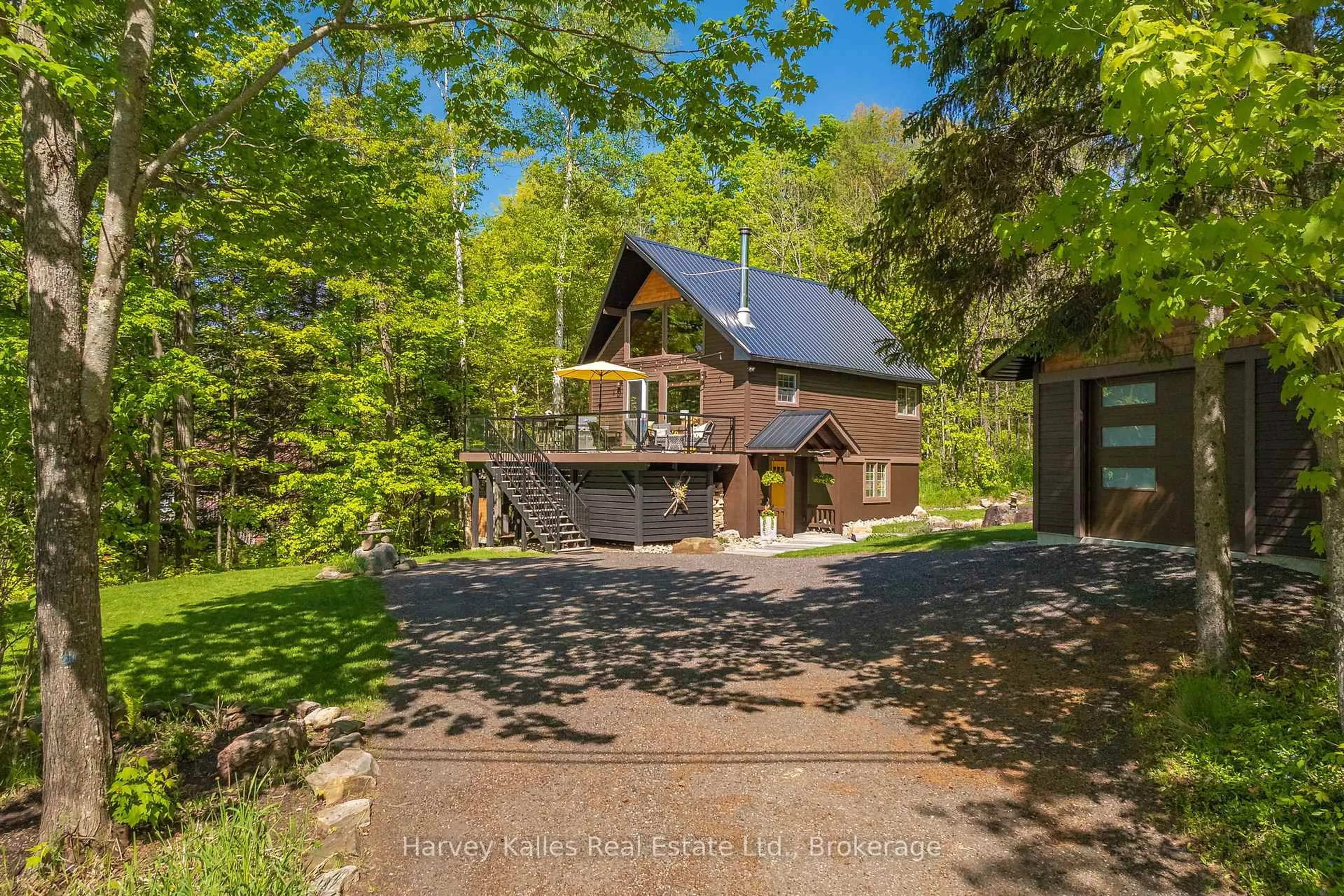 A pic from outside/outdoor area/front of a property/back of a property/a pic from drone, forest/trees view for 157 Chalet Cres, Huntsville Ontario P1H 1A8