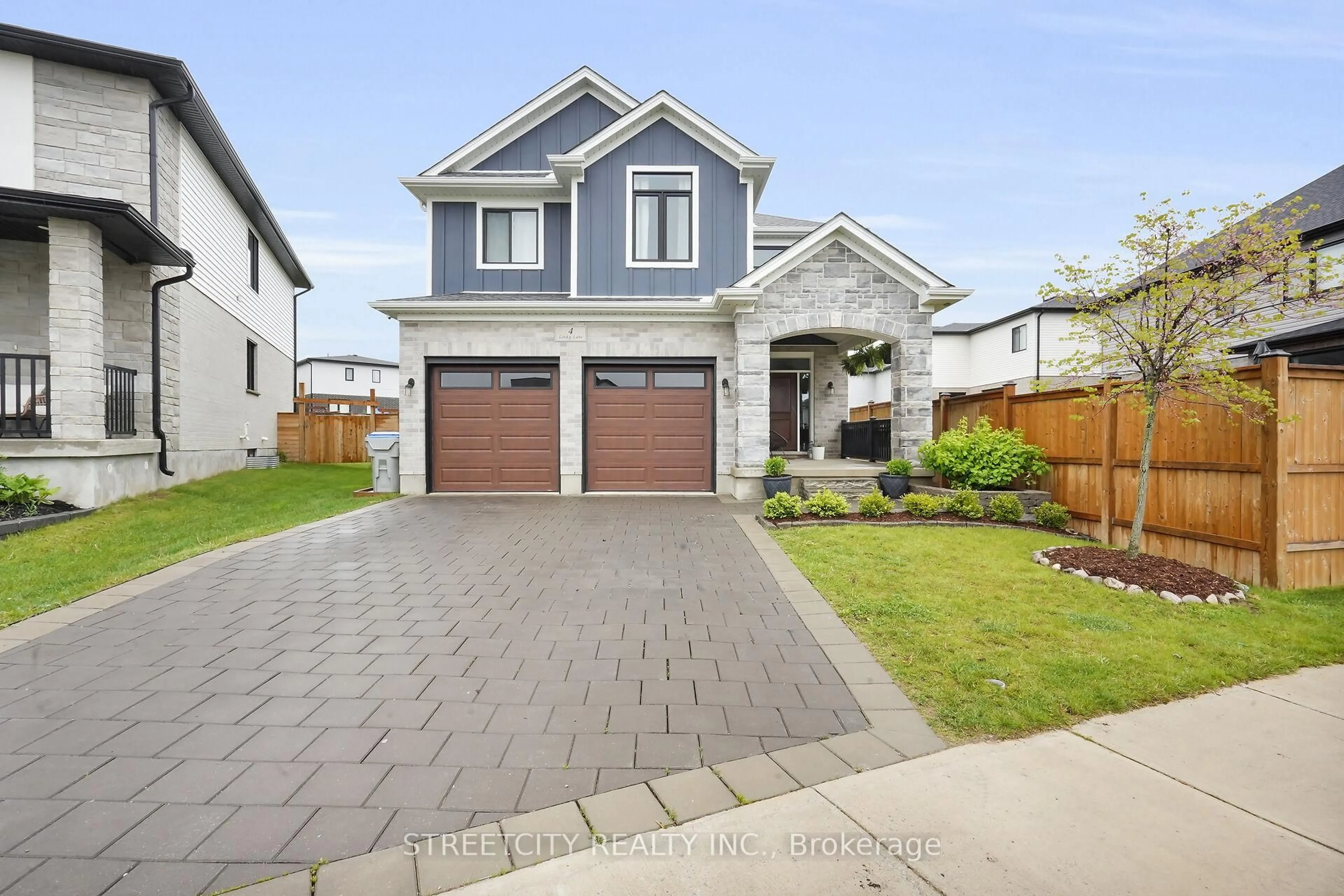 Home with brick exterior material, street for 4 Locky Lane, Middlesex Centre Ontario N0L 1R0
