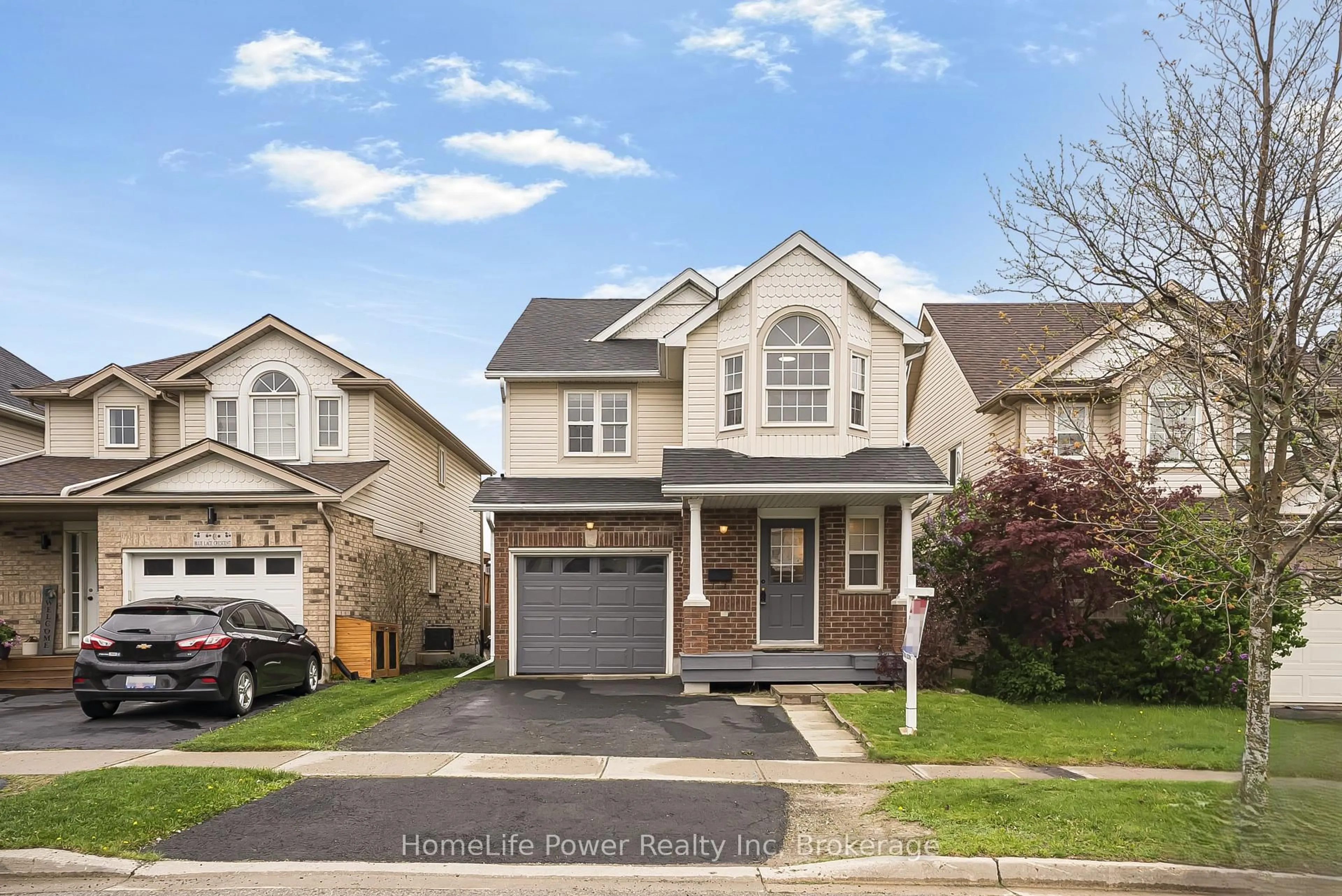 Home with vinyl exterior material, street for 74 Blue Lace Cres, Kitchener Ontario N2E 3X1