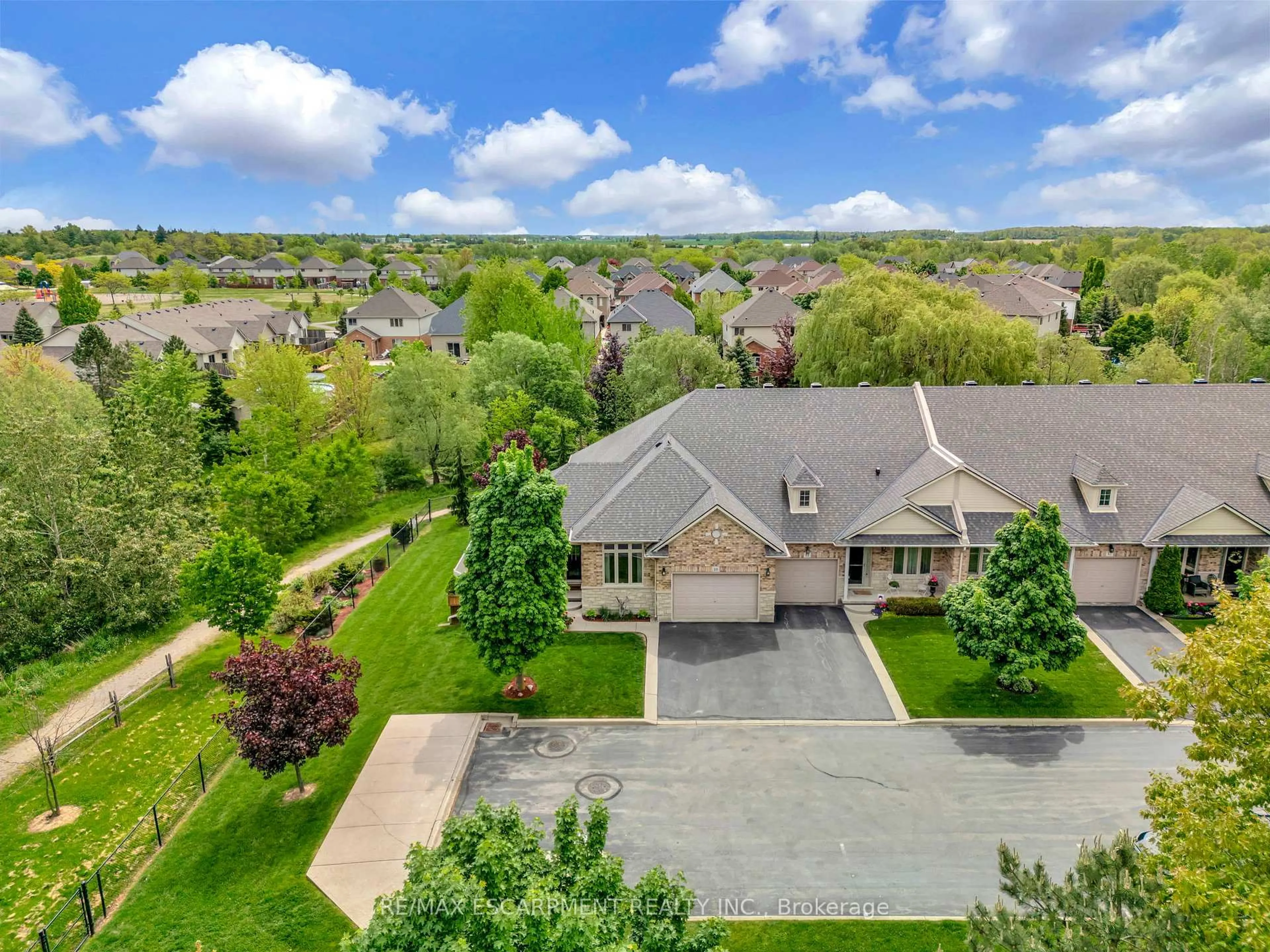 A pic from outside/outdoor area/front of a property/back of a property/a pic from drone, street for 310 Southbrook Dr #10, Hamilton Ontario L0R 1C0