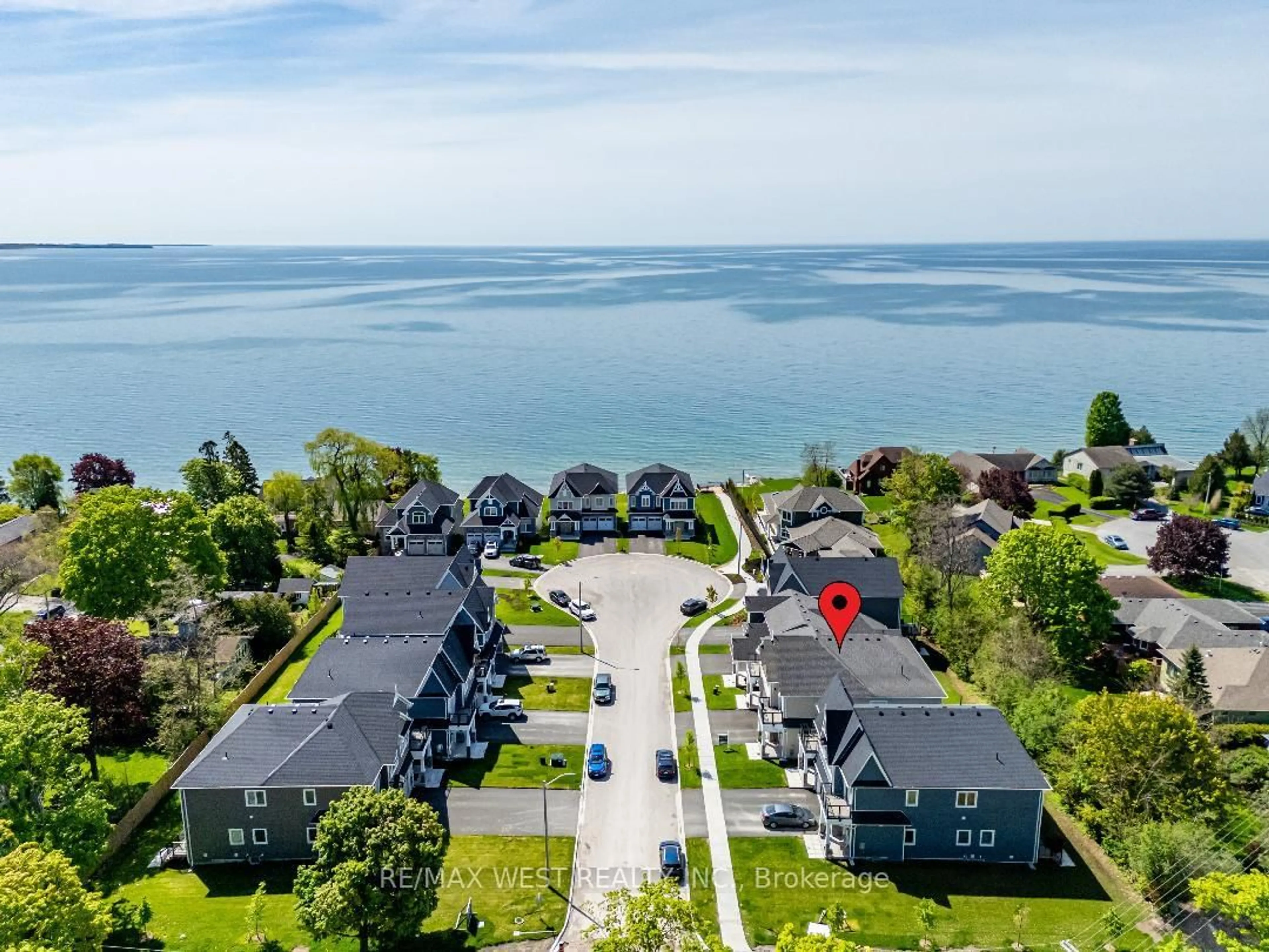 A pic from outside/outdoor area/front of a property/back of a property/a pic from drone, water/lake/river/ocean view for 7 Twelve Trees Crt, Prince Edward County Ontario K0K 3L0