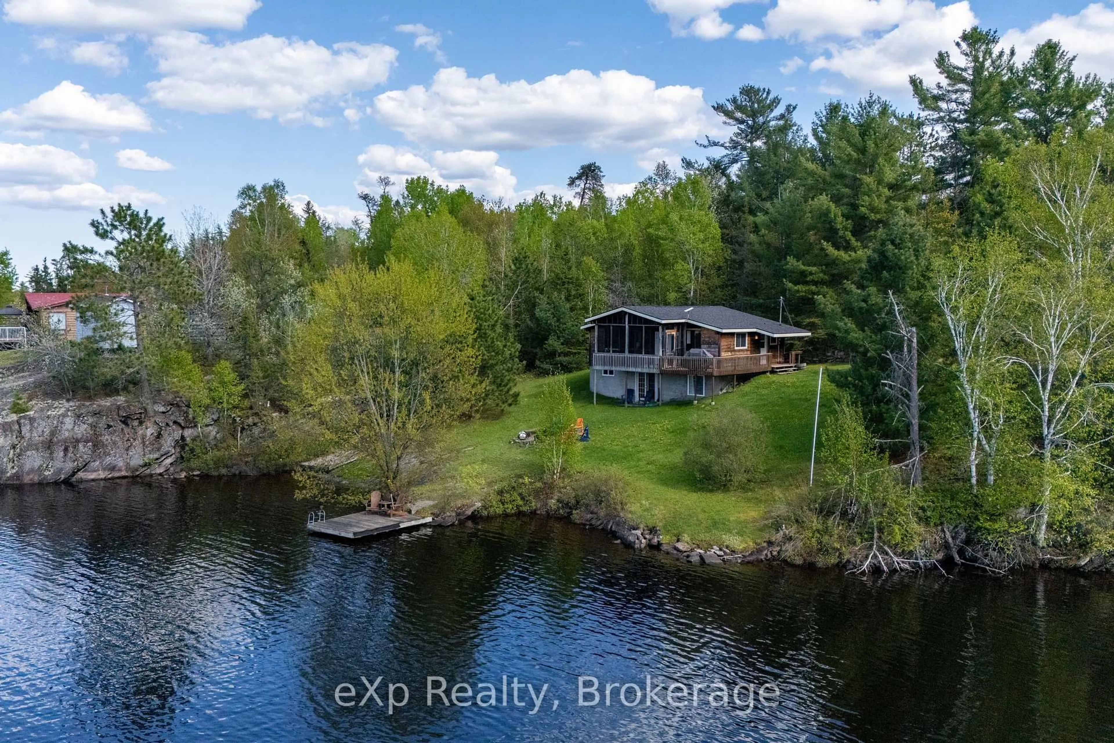 A pic from outside/outdoor area/front of a property/back of a property/a pic from drone, water/lake/river/ocean view for 472 Amateewakea River Rd, French River Ontario P0M 2W0