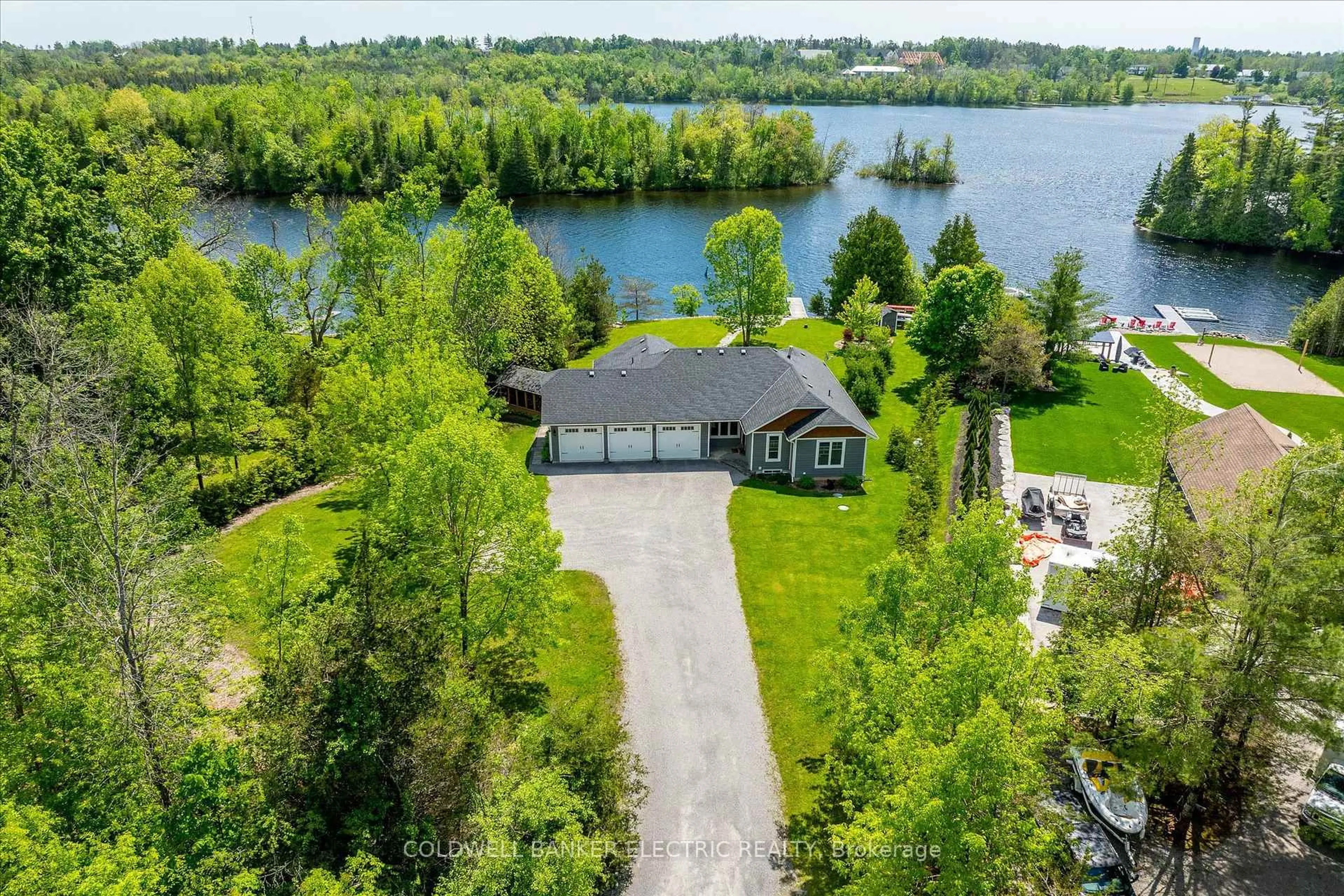 A pic from outside/outdoor area/front of a property/back of a property/a pic from drone, water/lake/river/ocean view for 2163 Marshall Lane, Selwyn Ontario K0L 2H0