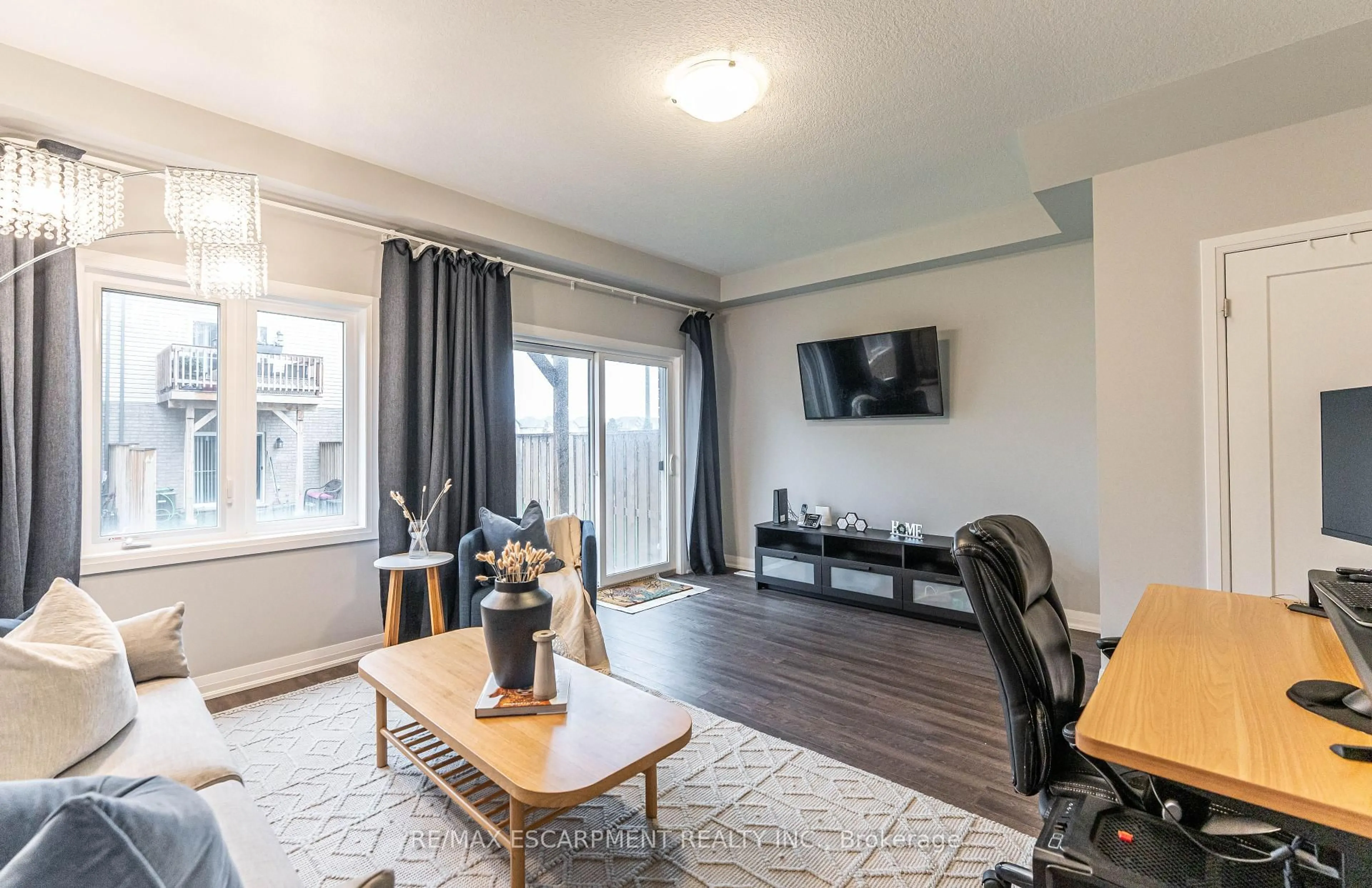 Living room with furniture, wood/laminate floor for 52 AQUARIUS Cres, Hamilton Ontario L8J 3H5