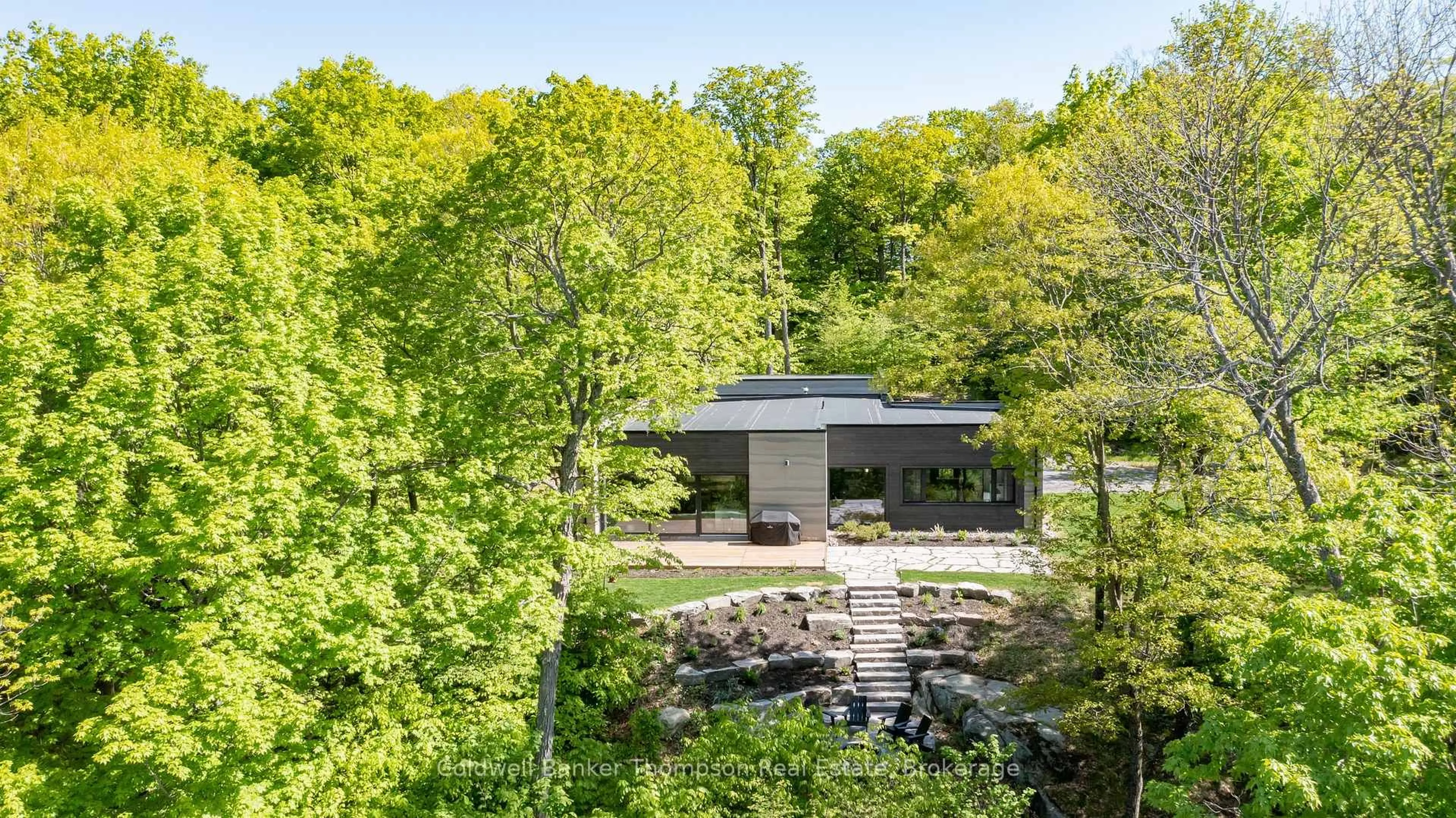 A pic from outside/outdoor area/front of a property/back of a property/a pic from drone, unknown for 100 Gryffin Bluffs Lane #16, Huntsville Ontario P0B 1M0
