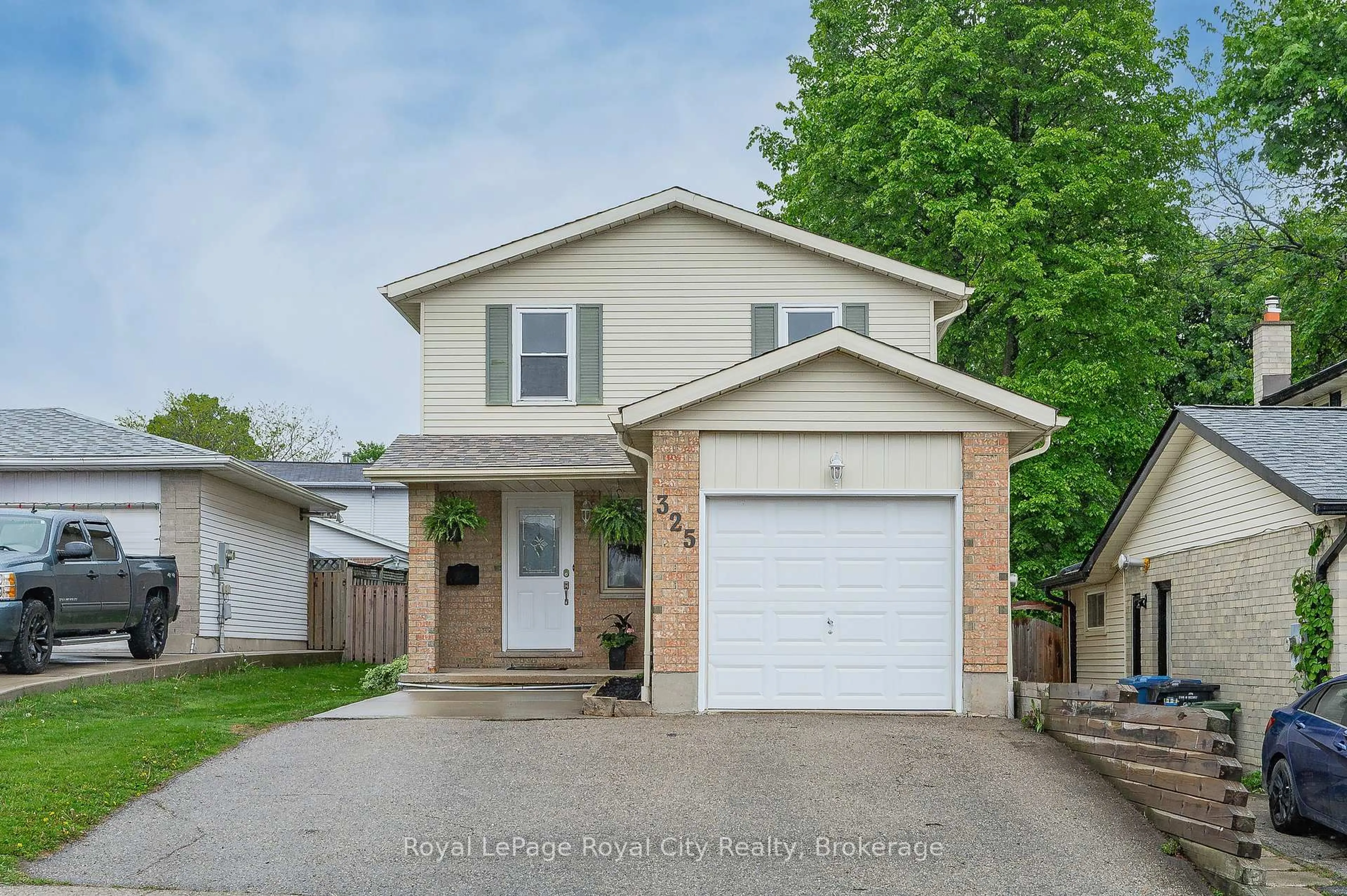 Home with vinyl exterior material, street for 325 AUDEN Rd, Guelph Ontario N1E 6S4
