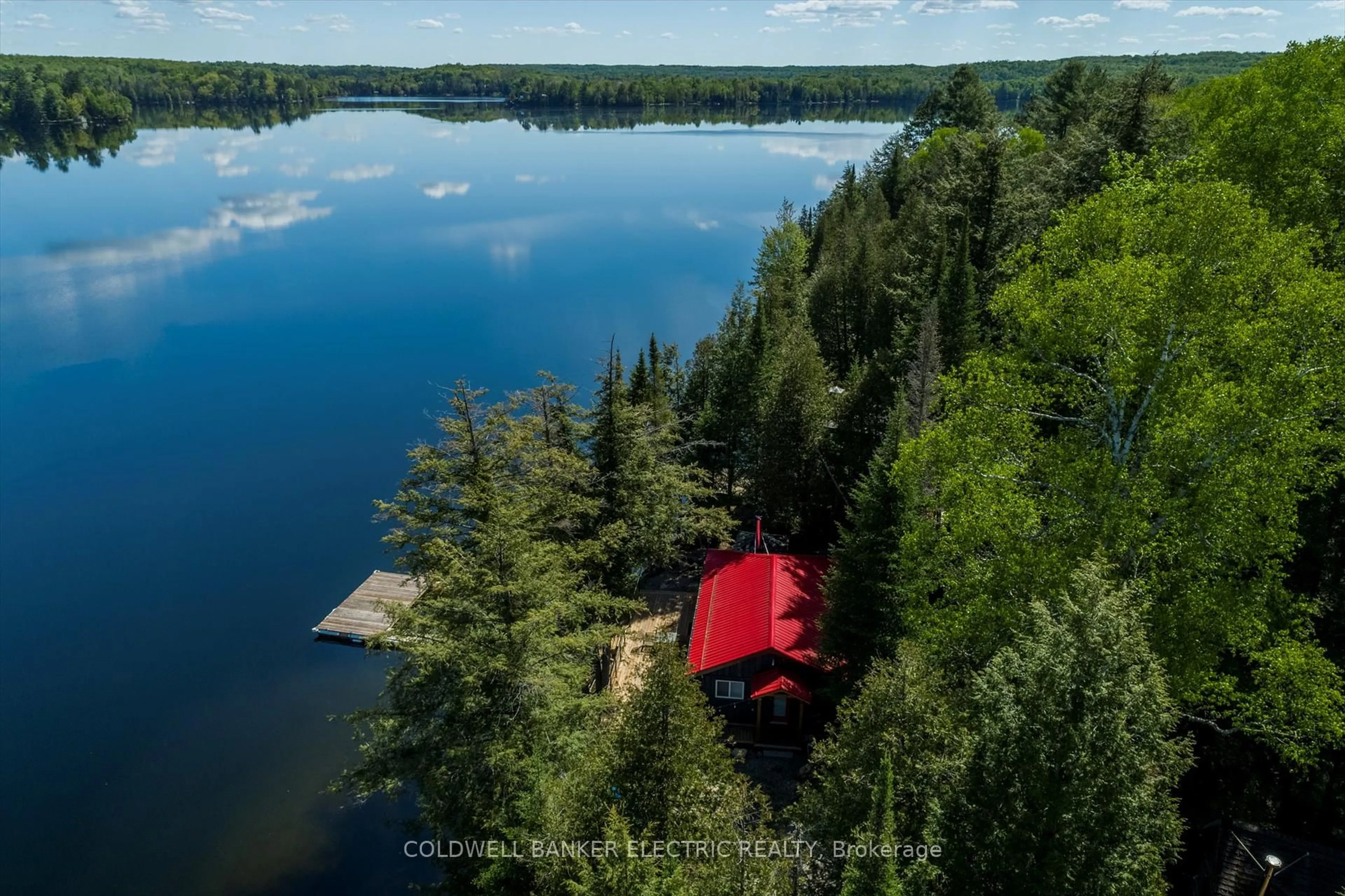 A pic from outside/outdoor area/front of a property/back of a property/a pic from drone, water/lake/river/ocean view for 1224 McCrackens Lane, Minden Hills Ontario K0M 2K0