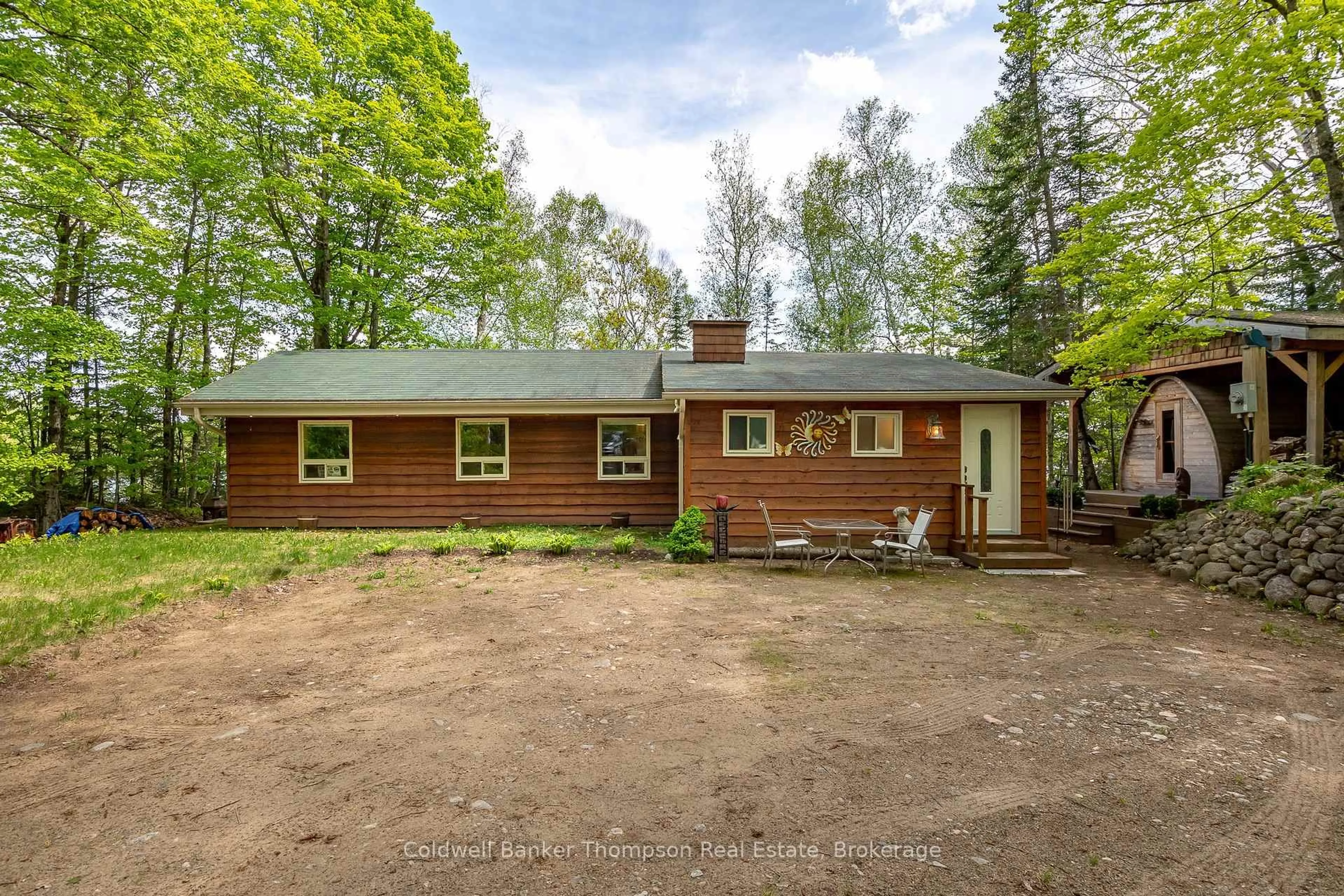 A pic from outside/outdoor area/front of a property/back of a property/a pic from drone, forest/trees view for 57 Mayflower Lane, Perry Ontario P0A 1J0