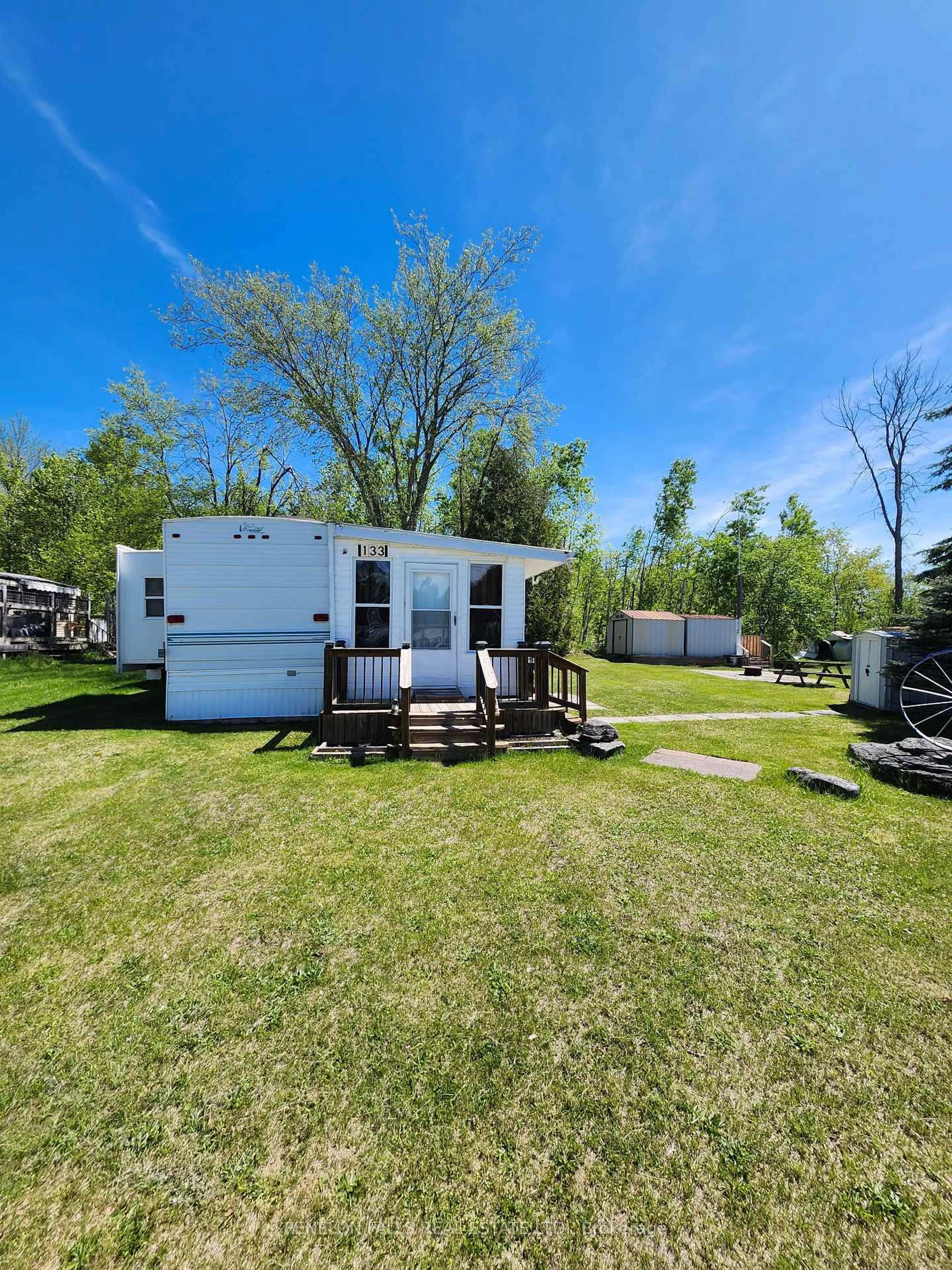 A pic from outside/outdoor area/front of a property/back of a property/a pic from drone, water/lake/river/ocean view for 1802 County Road 121 Rd #133, Kawartha Lakes Ontario K0M 1N0