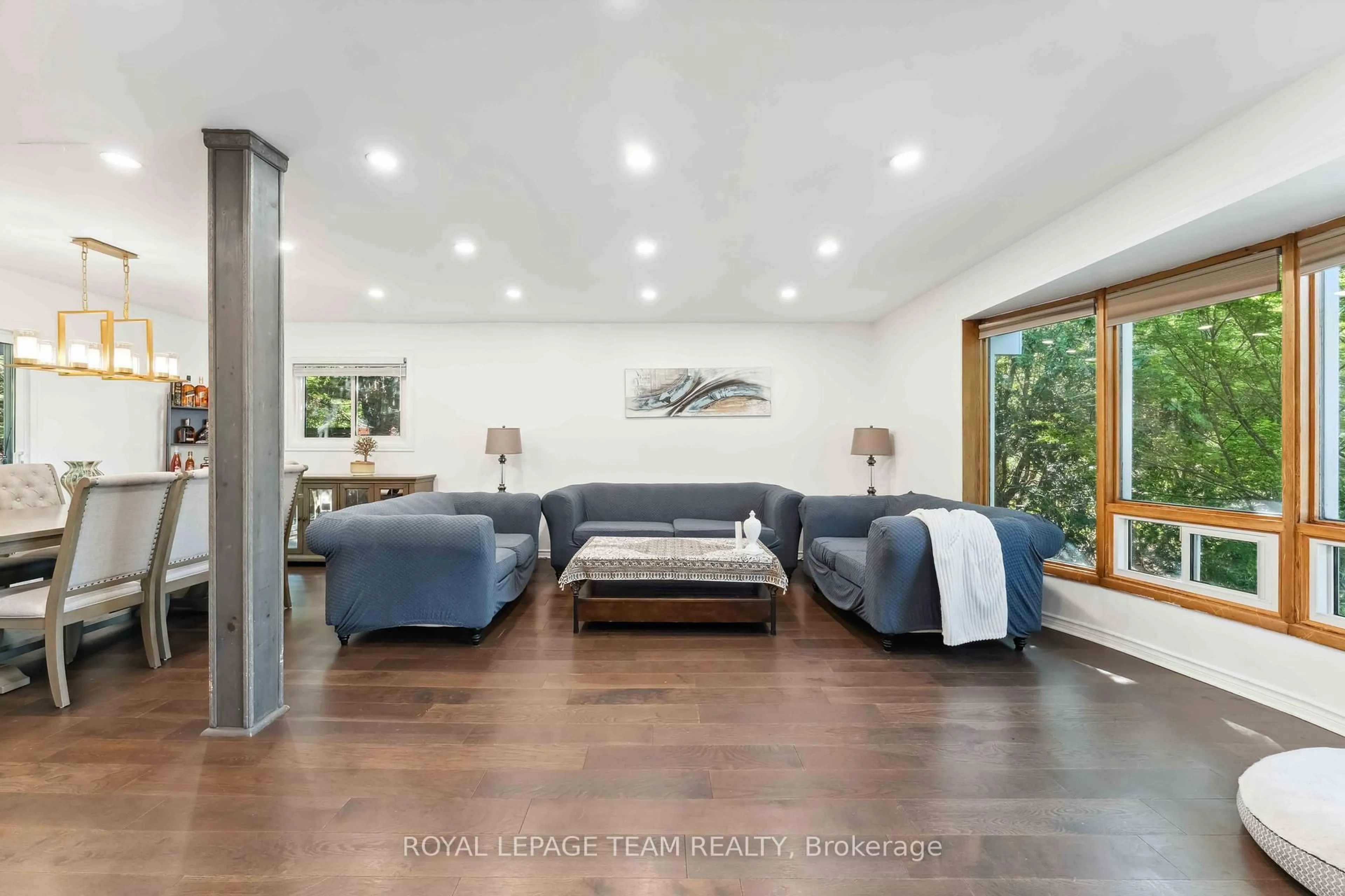 Living room with furniture, wood/laminate floor for 2353 Georgina Dr, Ottawa Ontario K2B 7M6