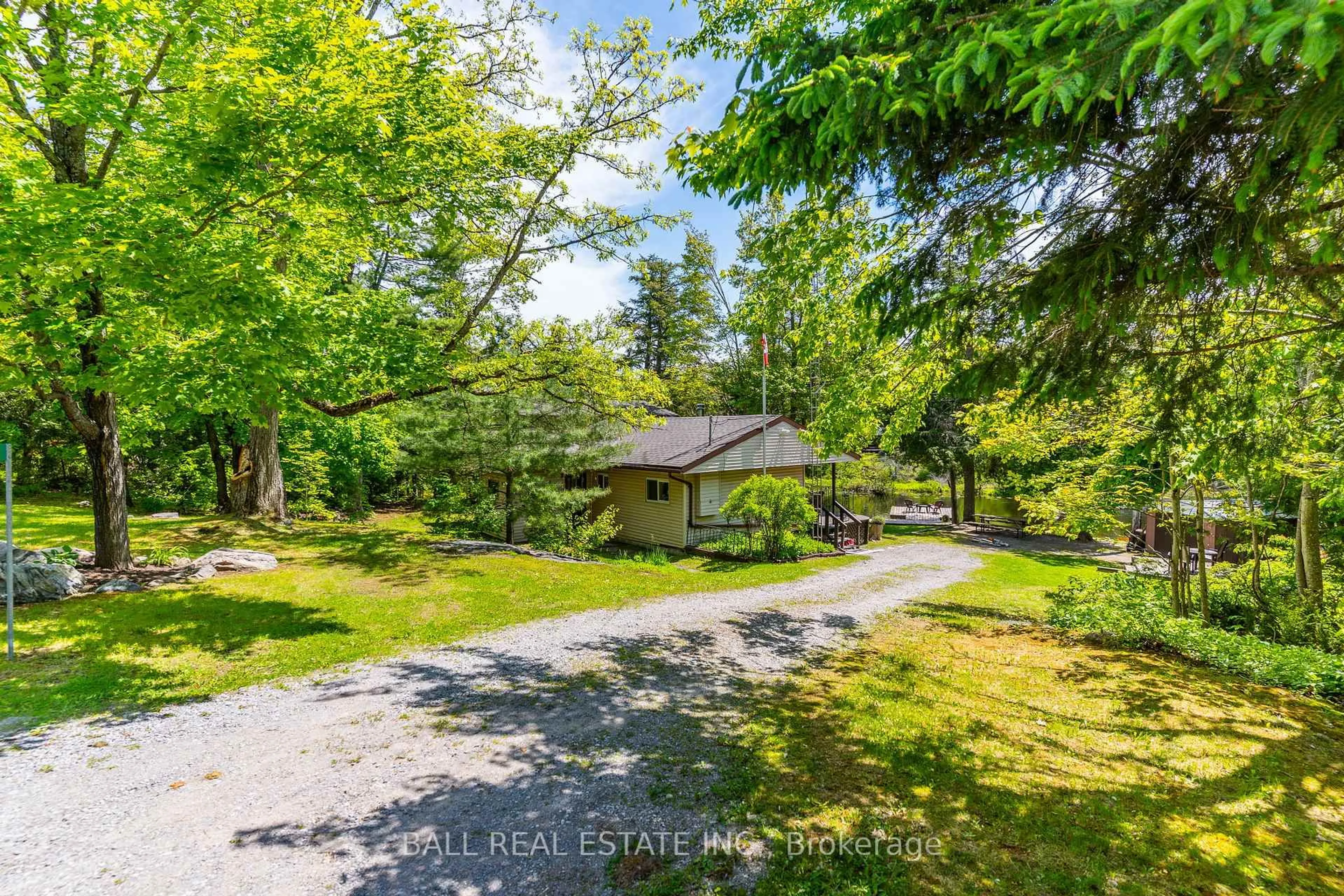 A pic from outside/outdoor area/front of a property/back of a property/a pic from drone, forest/trees view for 73 Sunset Crt, Trent Lakes Ontario K0M 1A0