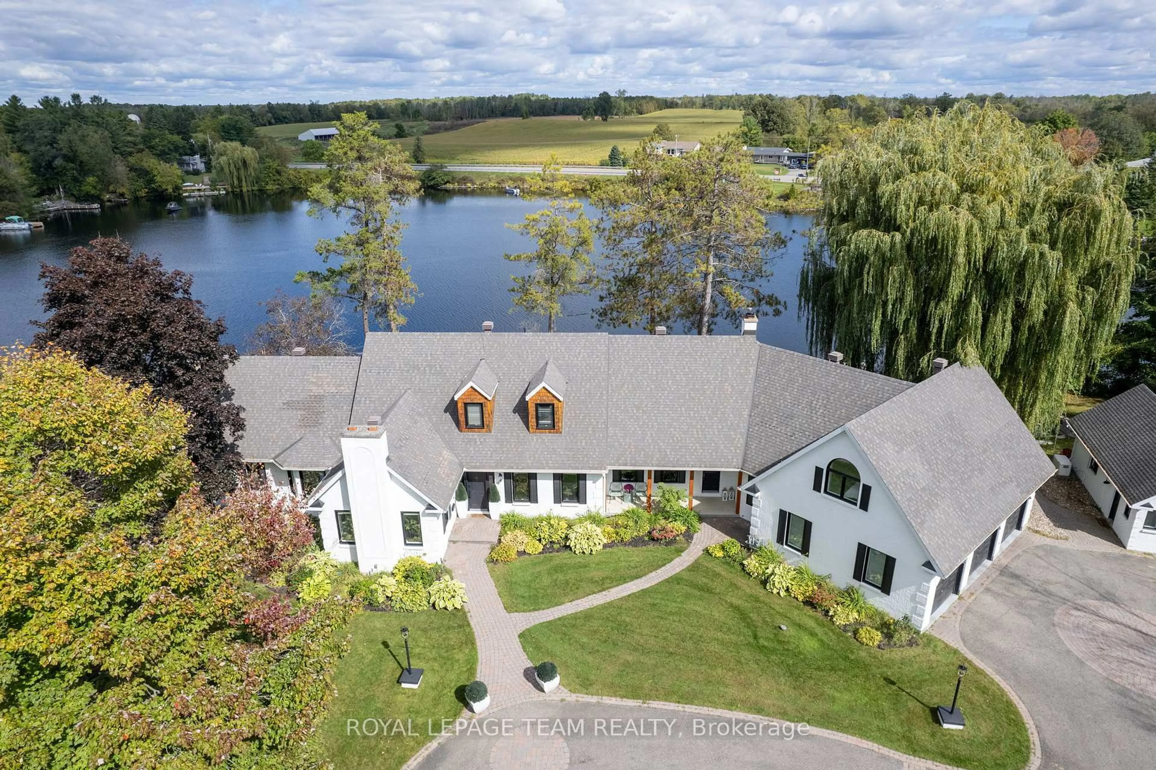 A pic from outside/outdoor area/front of a property/back of a property/a pic from drone, water/lake/river/ocean view for 6087 James Bell Dr, Manotick Ontario K4M 1B3