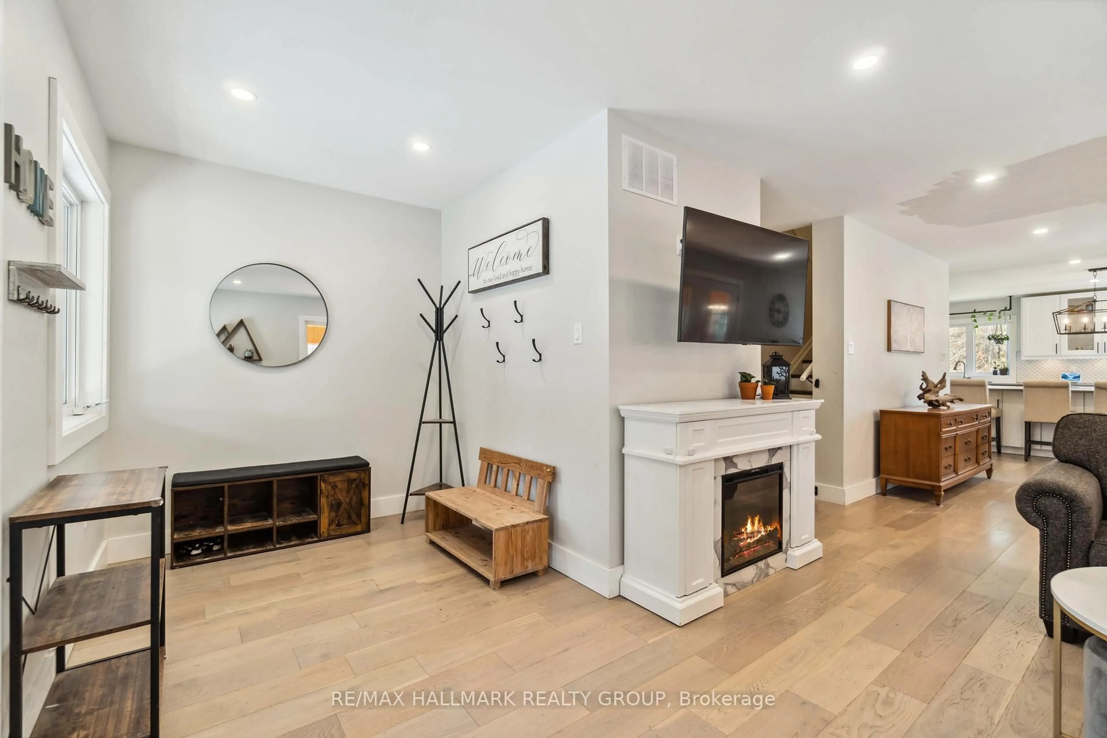 Living room with furniture, wood/laminate floor for 628 Sugar Bush Rd, Pakenham Ontario K0A 2X0