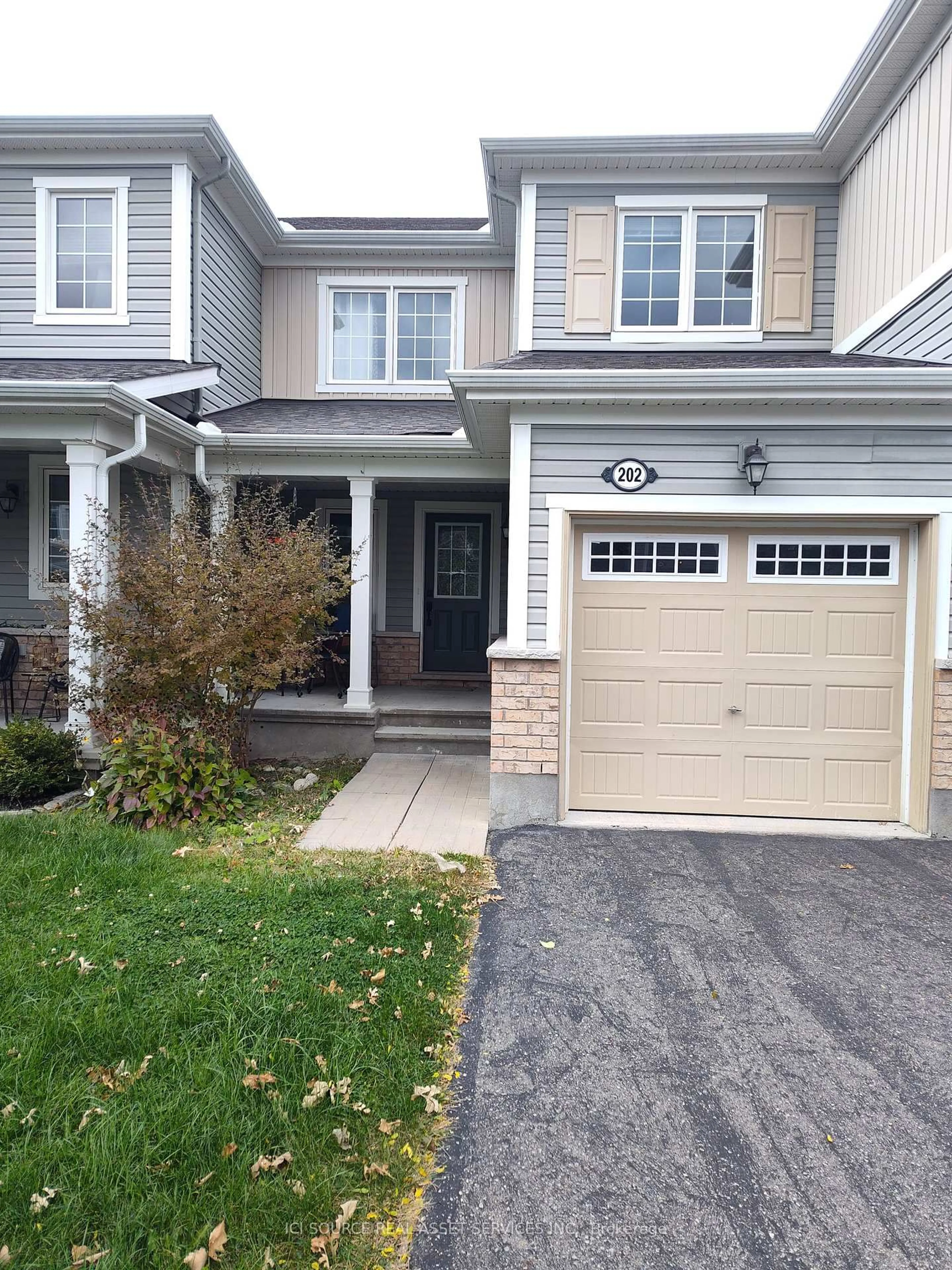 Home with vinyl exterior material, street for 202 Conifer Creek Circ, Ottawa Ontario K2M 0M2