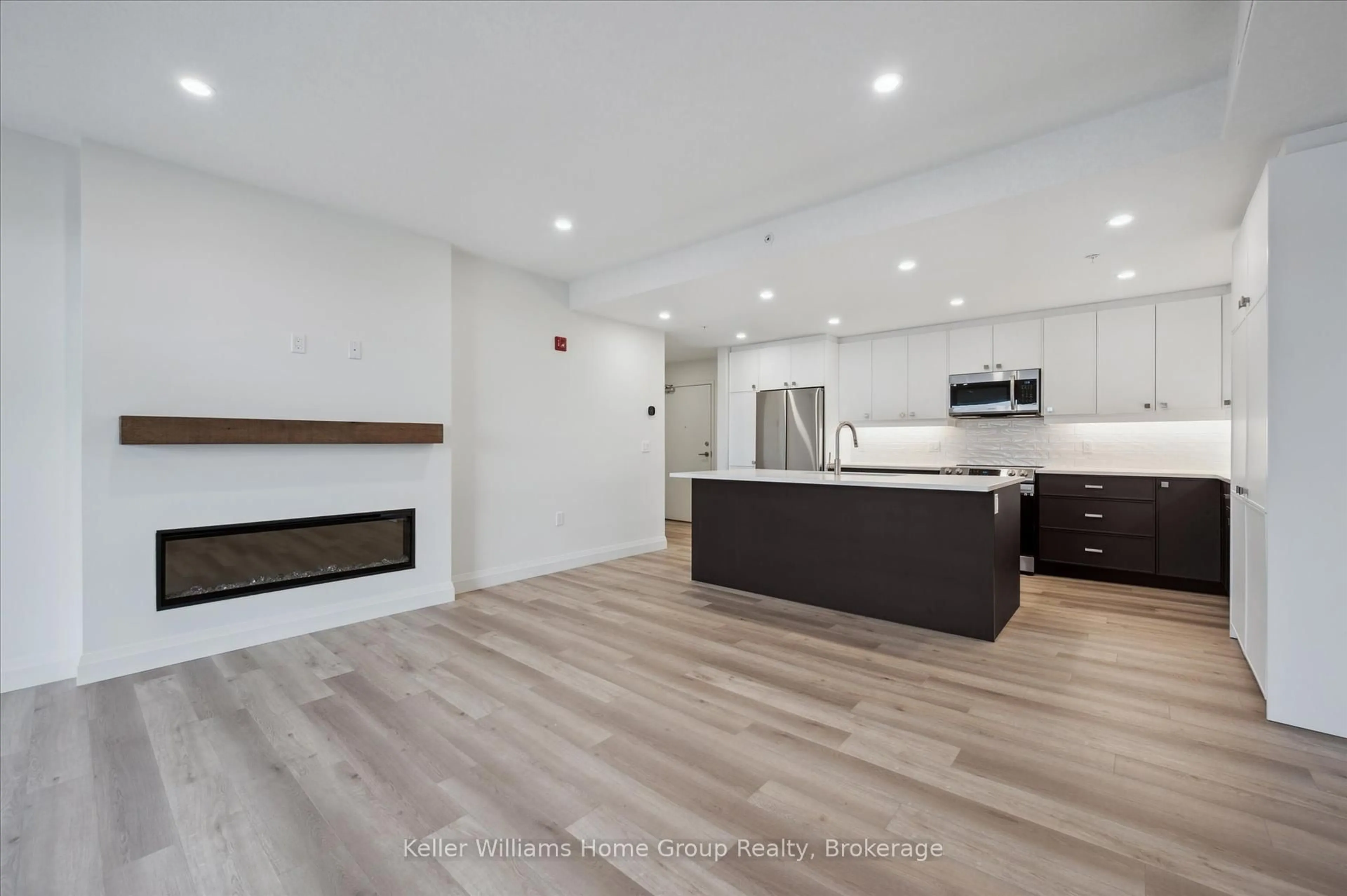 Open concept kitchen, wood/laminate floor for 99B Farley Rd #412, Centre Wellington Ontario N1M 0K5