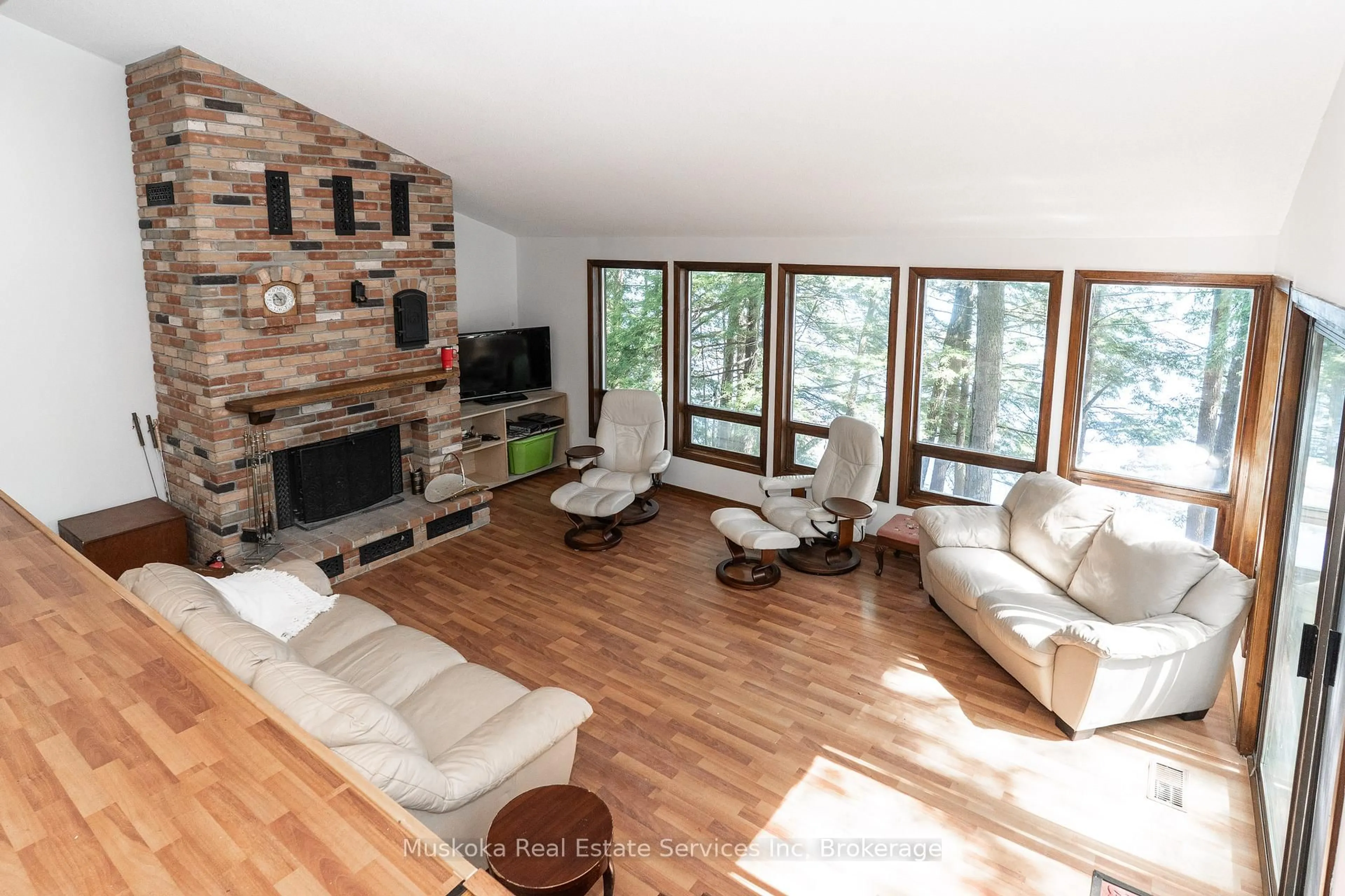 Living room with furniture, wood/laminate floor for 2920 Frank Miller Memorial hwy 169 Rte, Muskoka Lakes Ontario P1P 1R2