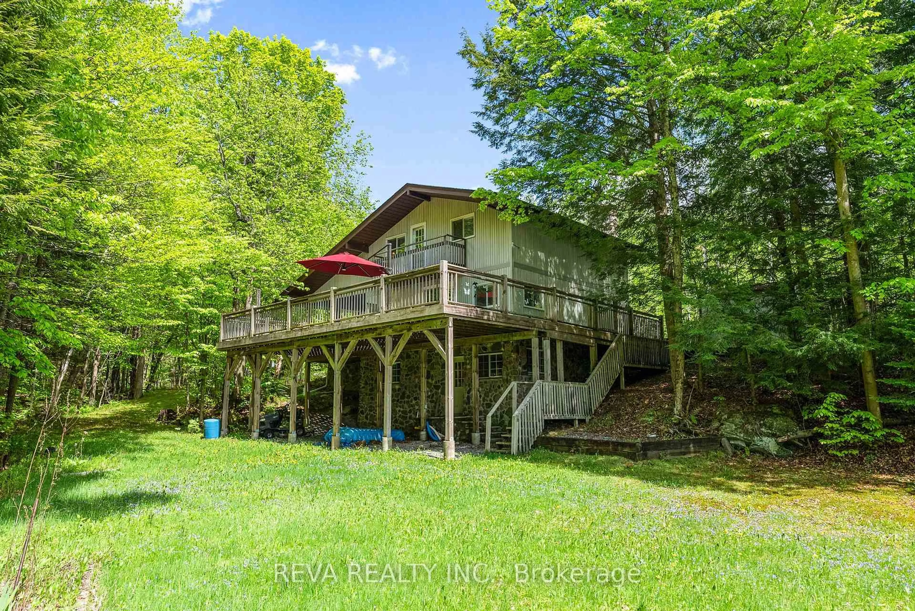 A pic from outside/outdoor area/front of a property/back of a property/a pic from drone, water/lake/river/ocean view for 1407 Spooks Bay Lane, Highlands East Ontario K0L 2C0