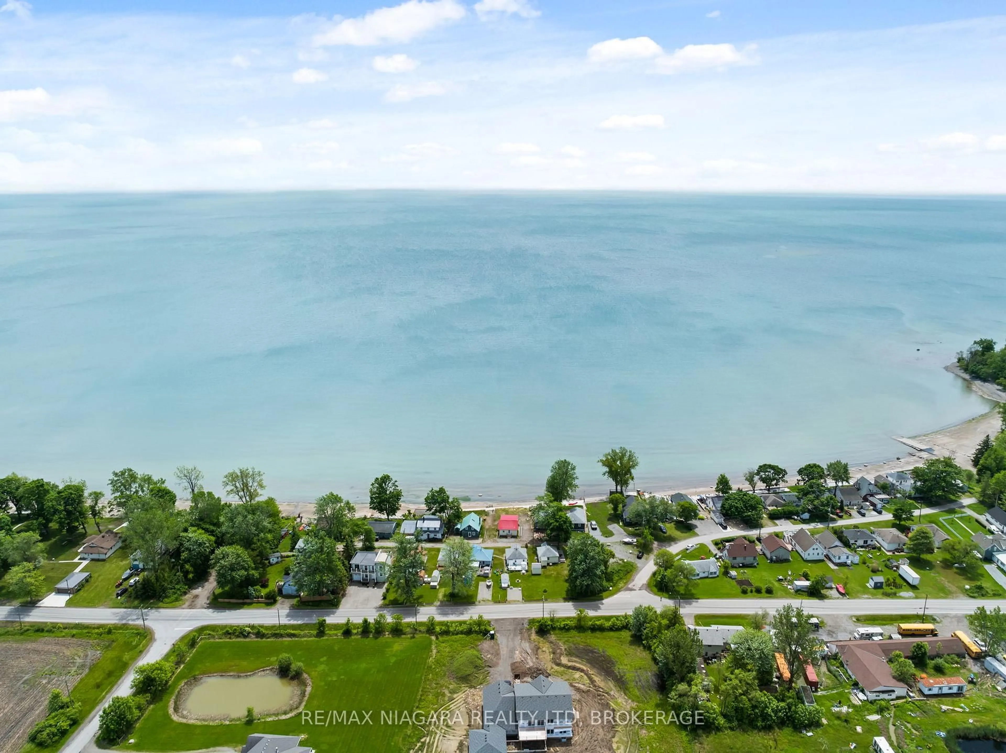 A pic from outside/outdoor area/front of a property/back of a property/a pic from drone, water/lake/river/ocean view for 12807-12815 LAKESHORE Rd, Wainfleet Ontario L0S 1V0
