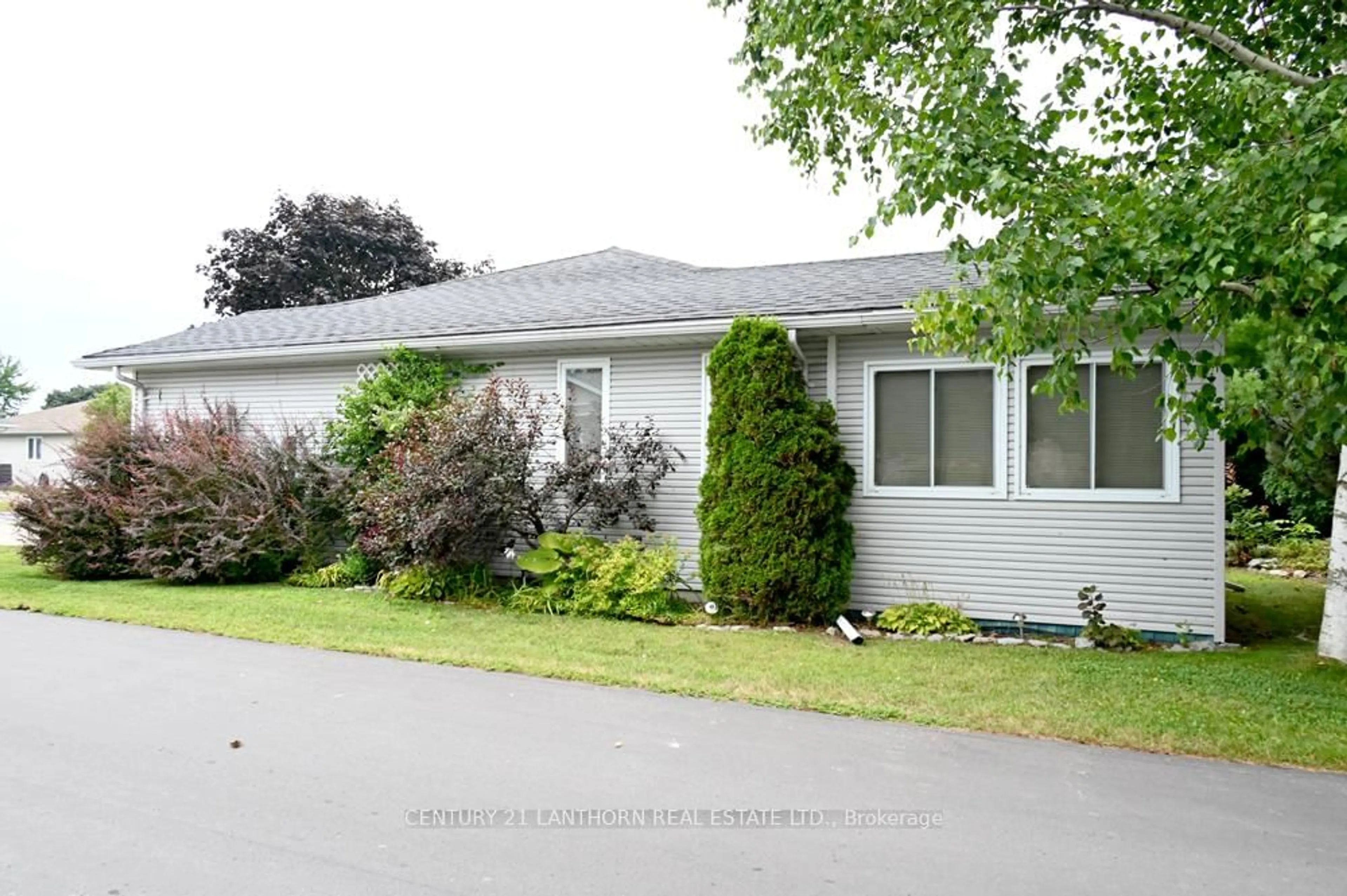 Home with vinyl exterior material, street for 1 Reynolds Pl, Prince Edward County Ontario K0K 3L0