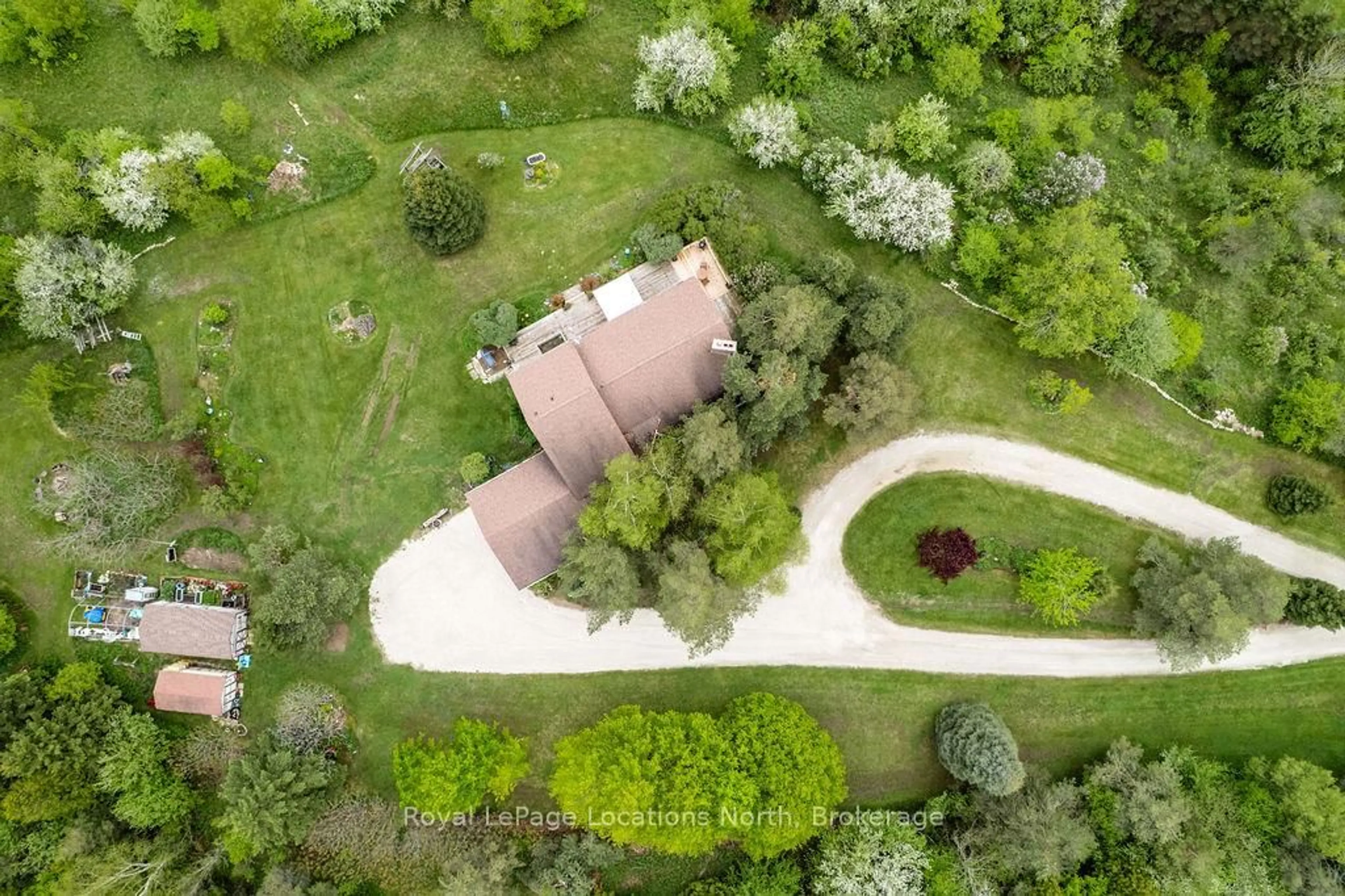 A pic from outside/outdoor area/front of a property/back of a property/a pic from drone, forest/trees view for 38 Old Carriage Rd, East Garafraxa Ontario L9W 6B2