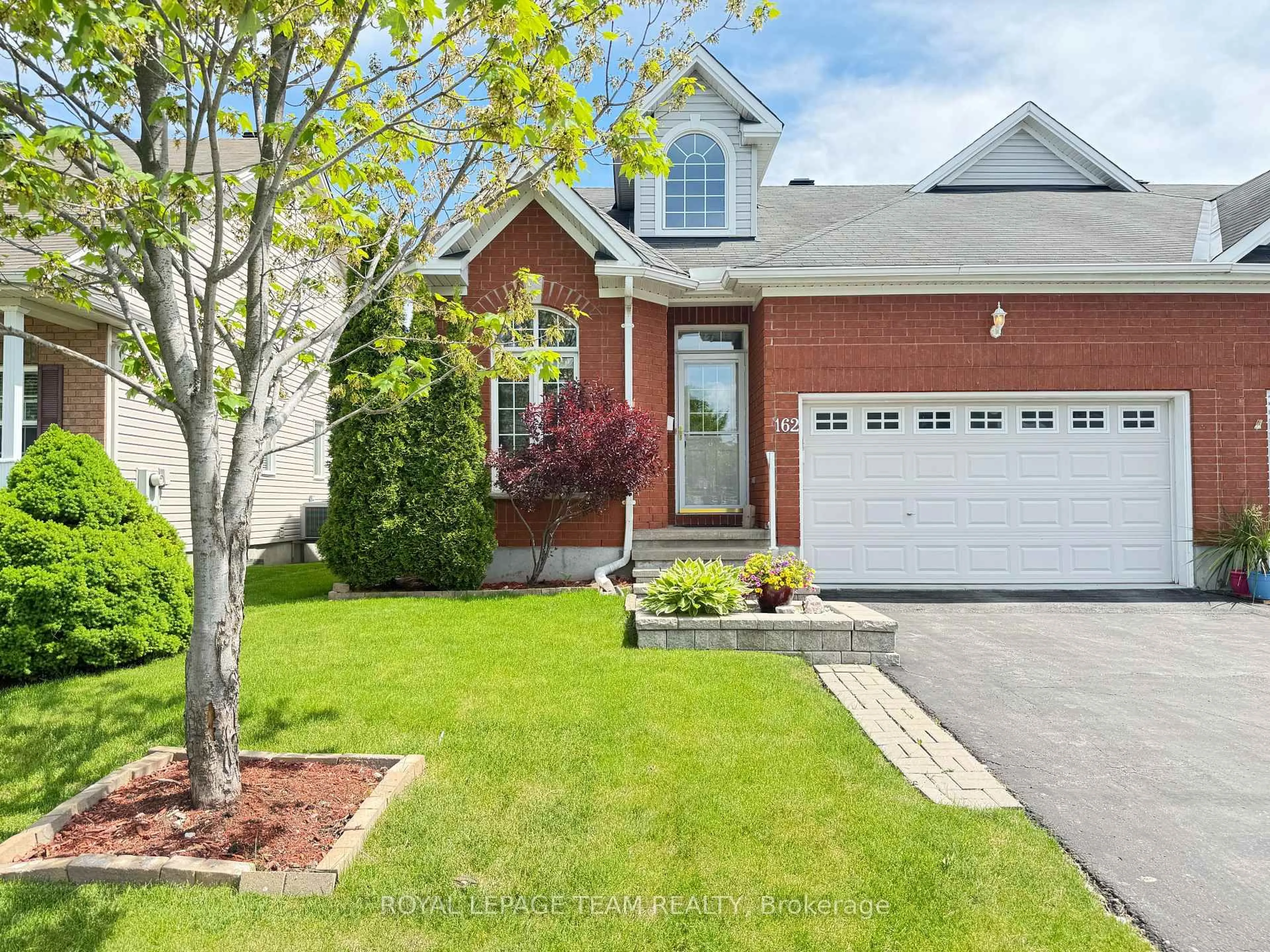 Home with brick exterior material, street for 162 Hartsmere Dr, Ottawa Ontario K2S 2H4