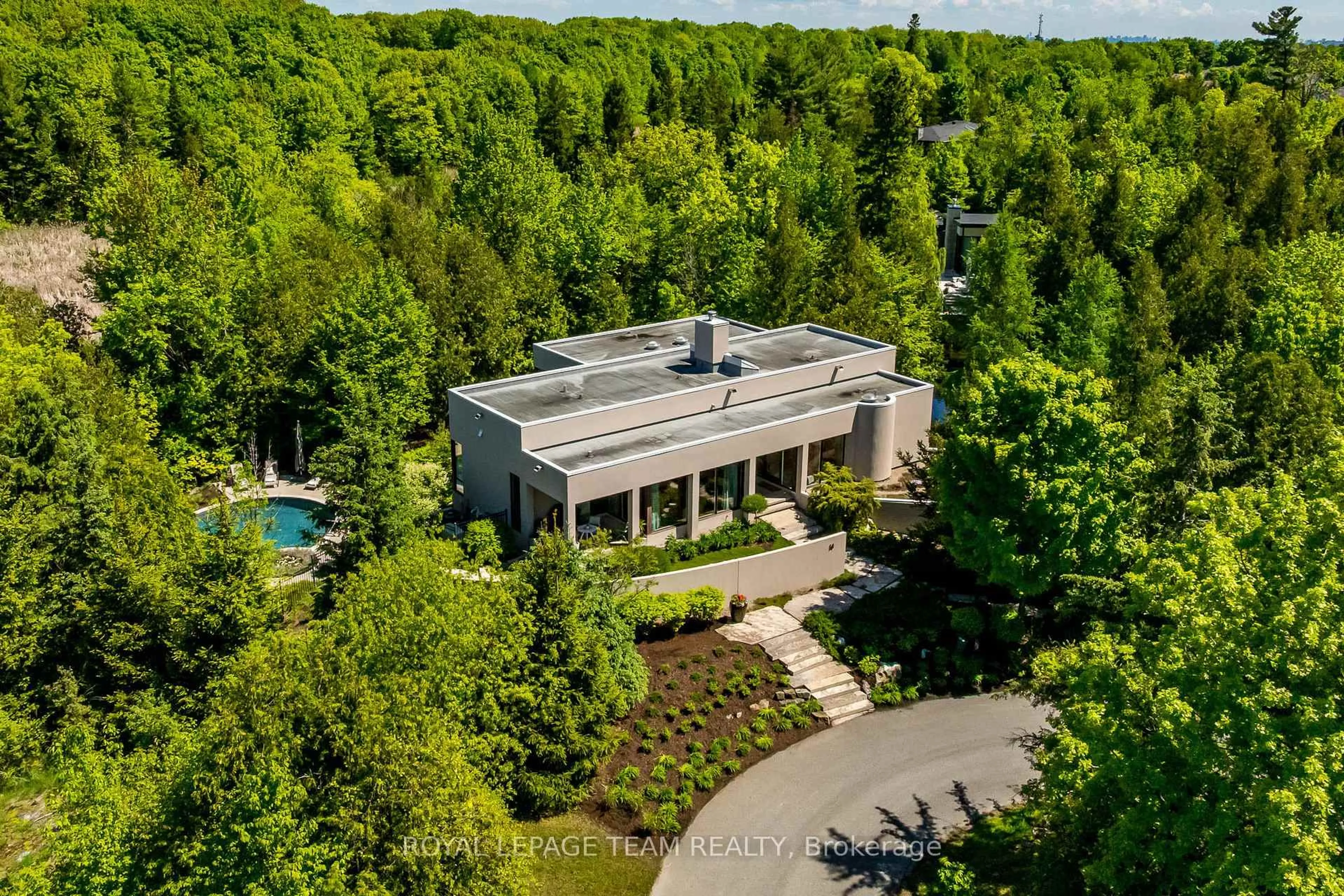 A pic from outside/outdoor area/front of a property/back of a property/a pic from drone, forest/trees view for 14 Kanata Rockeries Private, Ottawa Ontario K2K 3P4