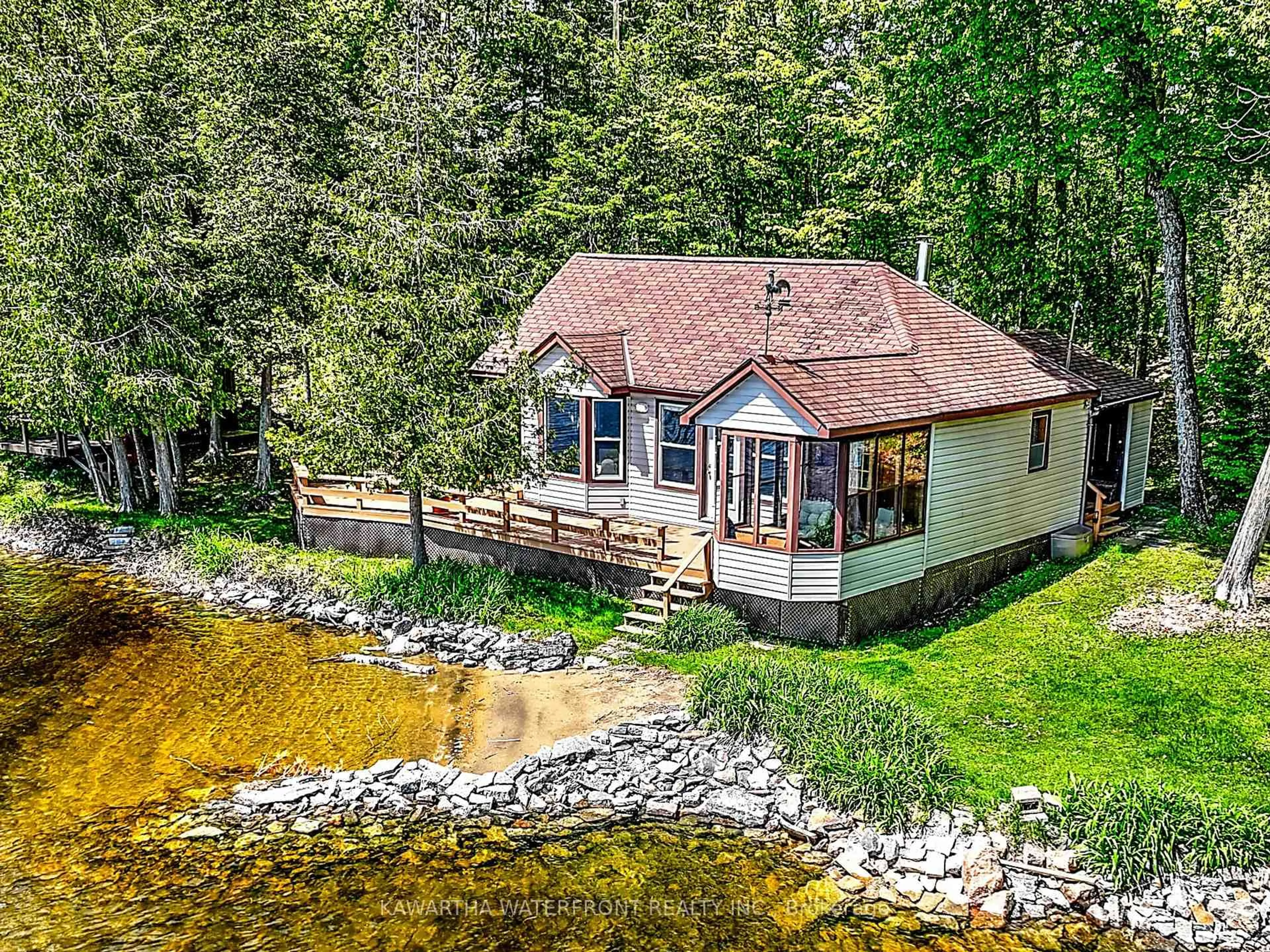A pic from outside/outdoor area/front of a property/back of a property/a pic from drone, water/lake/river/ocean view for 103 Shadow Lake 2 Rd, Kawartha Lakes Ontario K0M 2L0