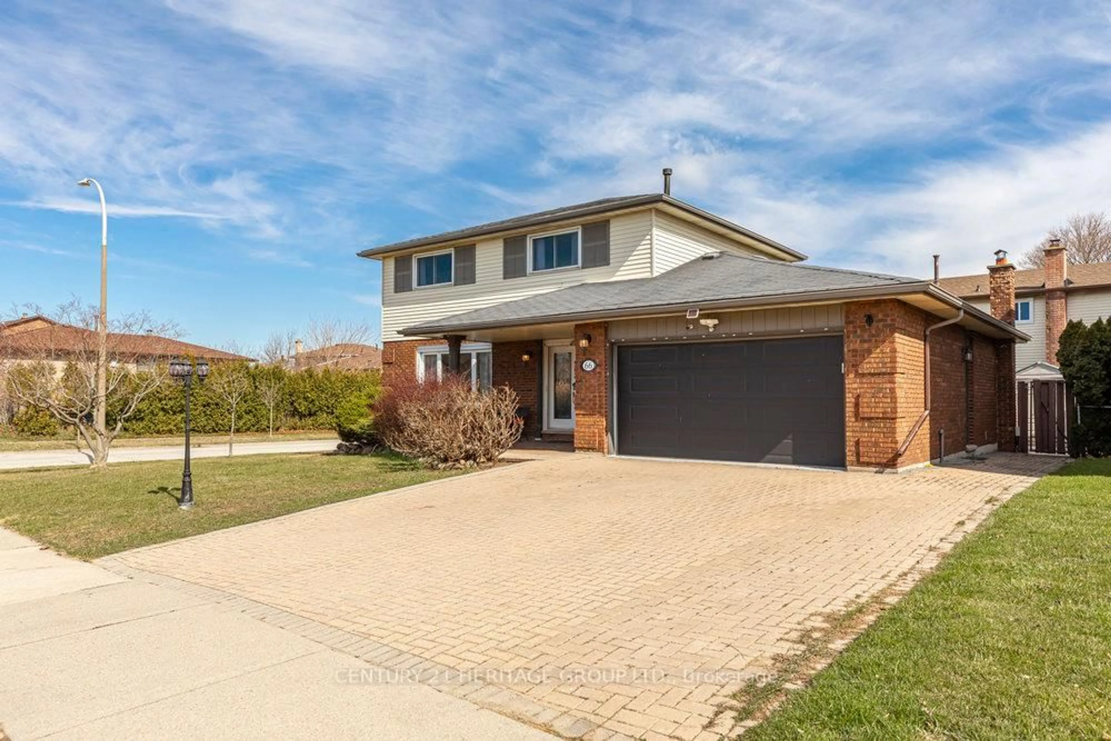 Home with brick exterior material, street for 66 Seaton Place Dr, Hamilton Ontario L8E 4B1
