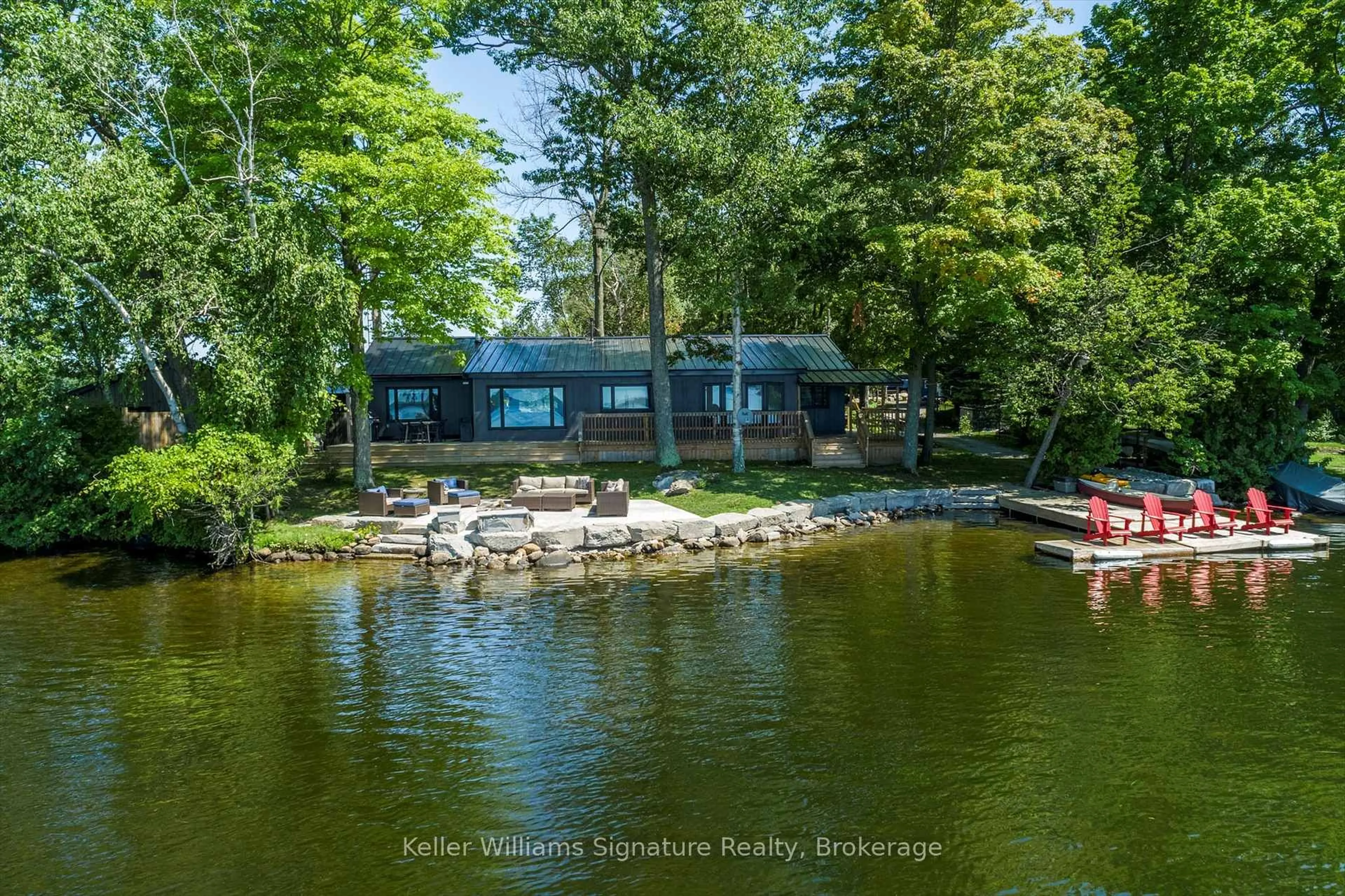 A pic from outside/outdoor area/front of a property/back of a property/a pic from drone, water/lake/river/ocean view for 135 Driftwood Village Rd, Kawartha Lakes Ontario K0M 1K0