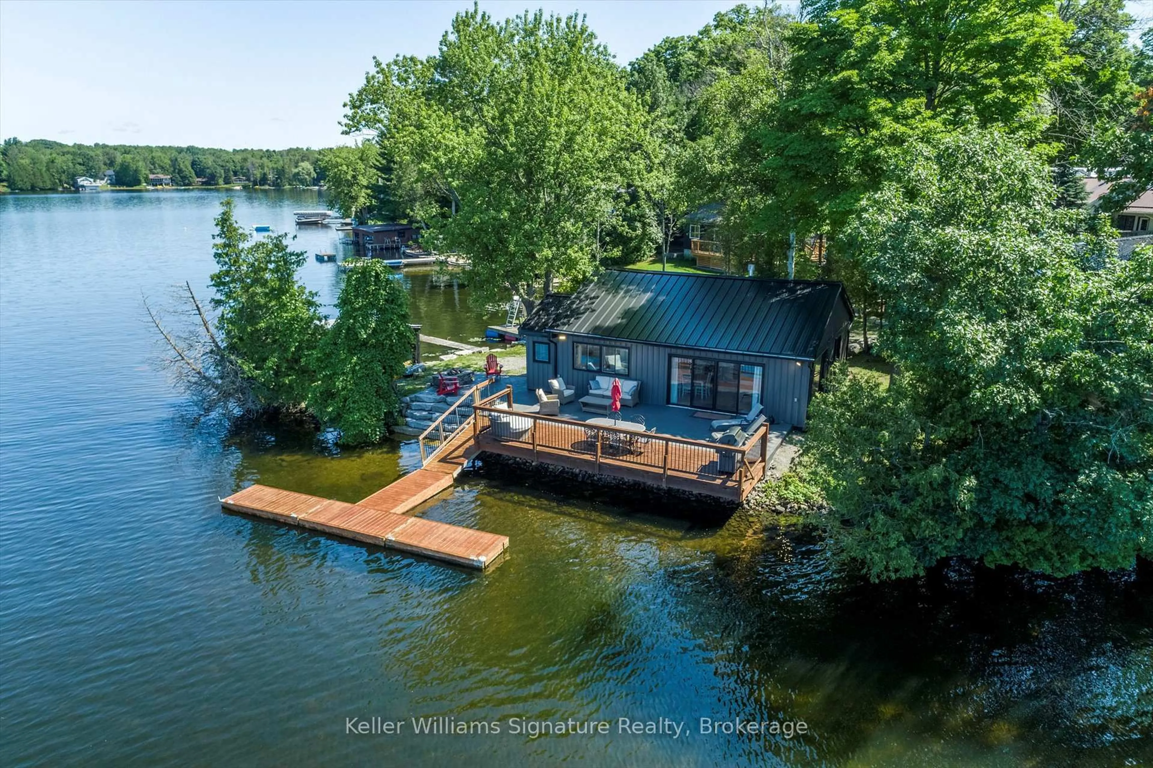 A pic from outside/outdoor area/front of a property/back of a property/a pic from drone, water/lake/river/ocean view for 135 Driftwood Village Rd, Kawartha Lakes Ontario K0M 1K0