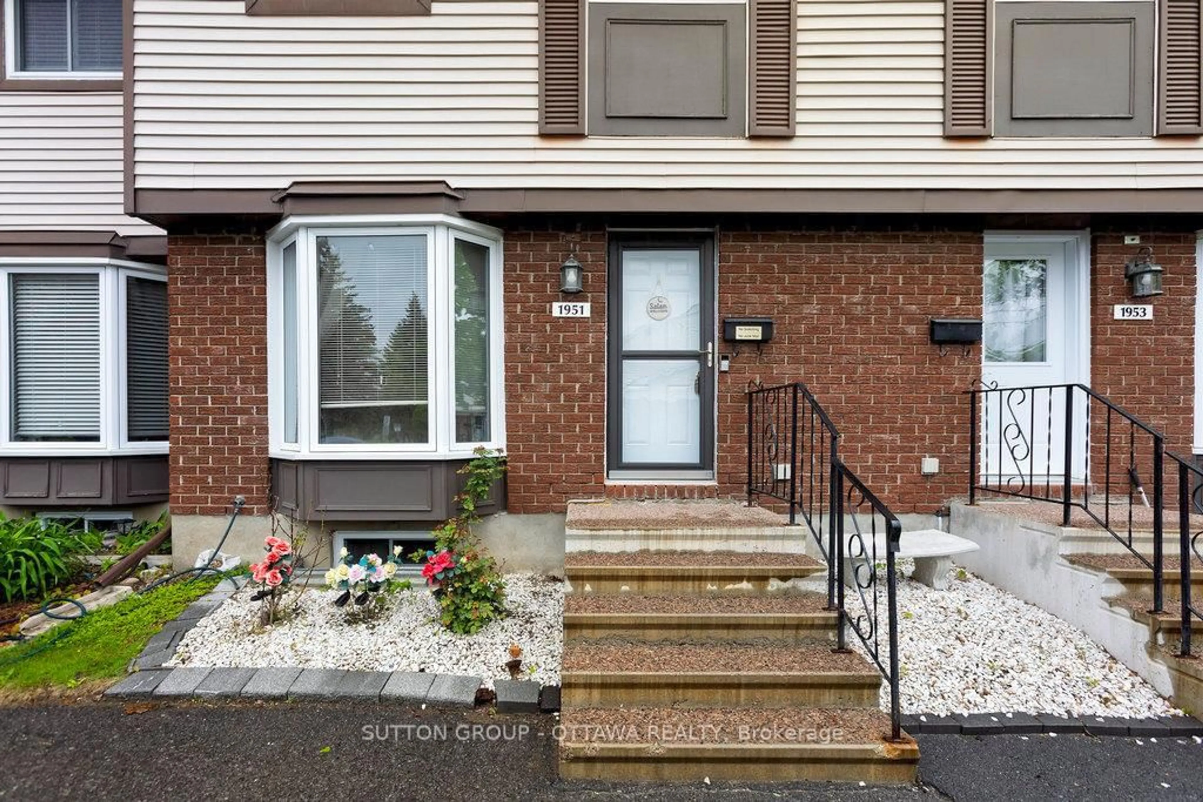 Home with brick exterior material, street for 1951 Greenvale Lane, Ottawa Ontario K1C 6E2