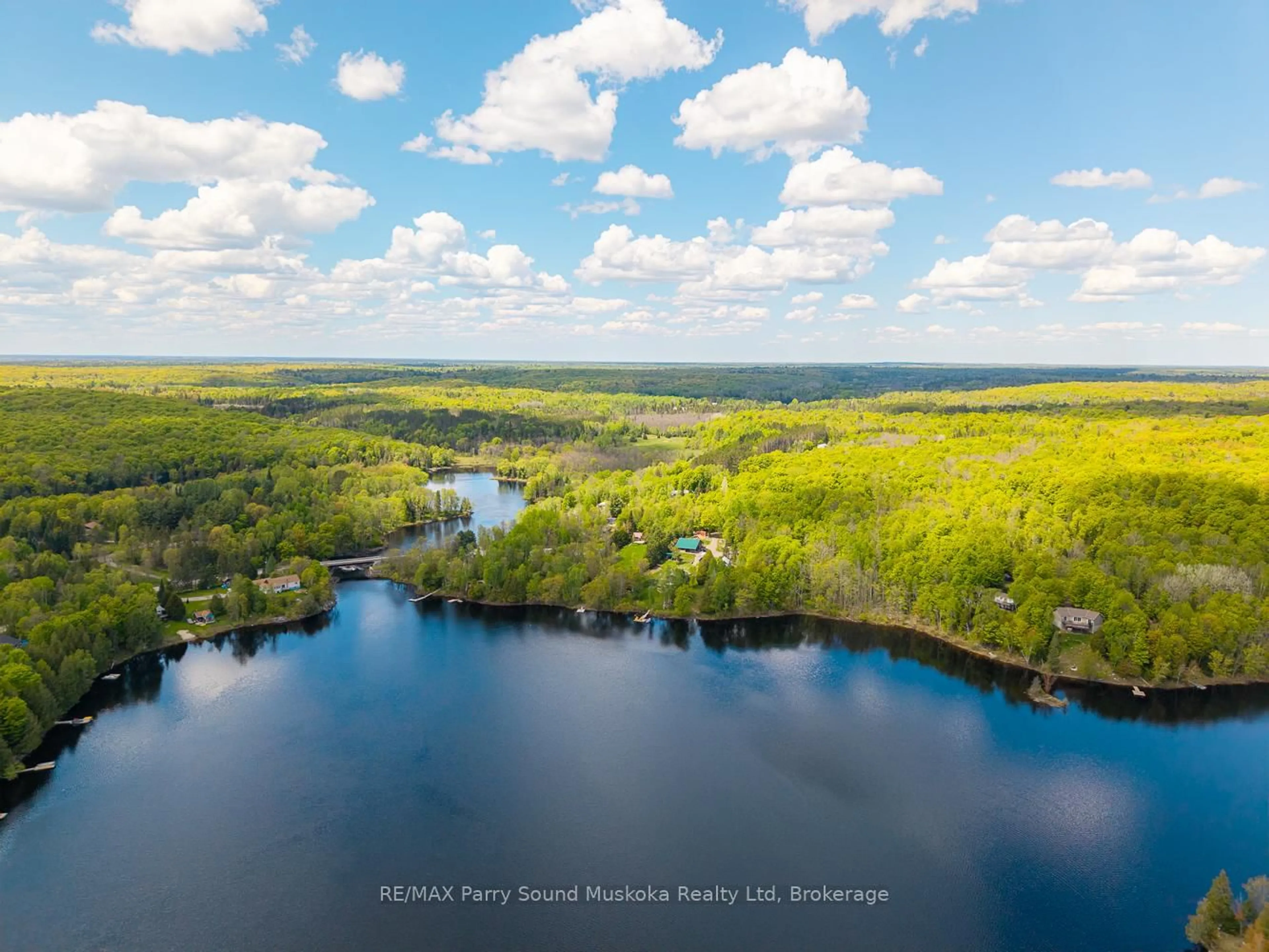 A pic from outside/outdoor area/front of a property/back of a property/a pic from drone, water/lake/river/ocean view for 57 Shady Maple Tr, Whitestone Ontario P0A 1G0