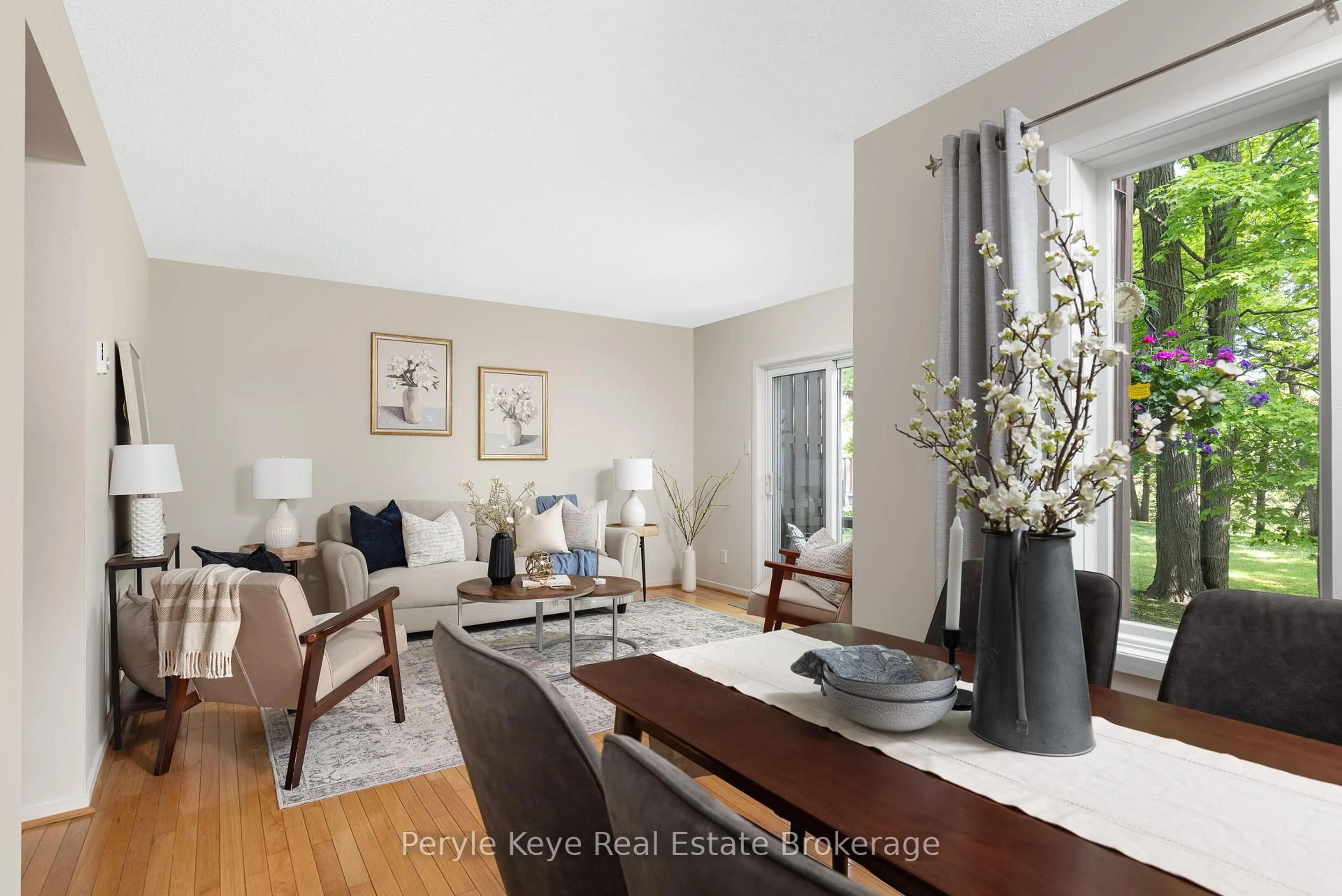 Living room with furniture, wood/laminate floor for 63 Southbank Dr #2, Bracebridge Ontario P1L 1G2