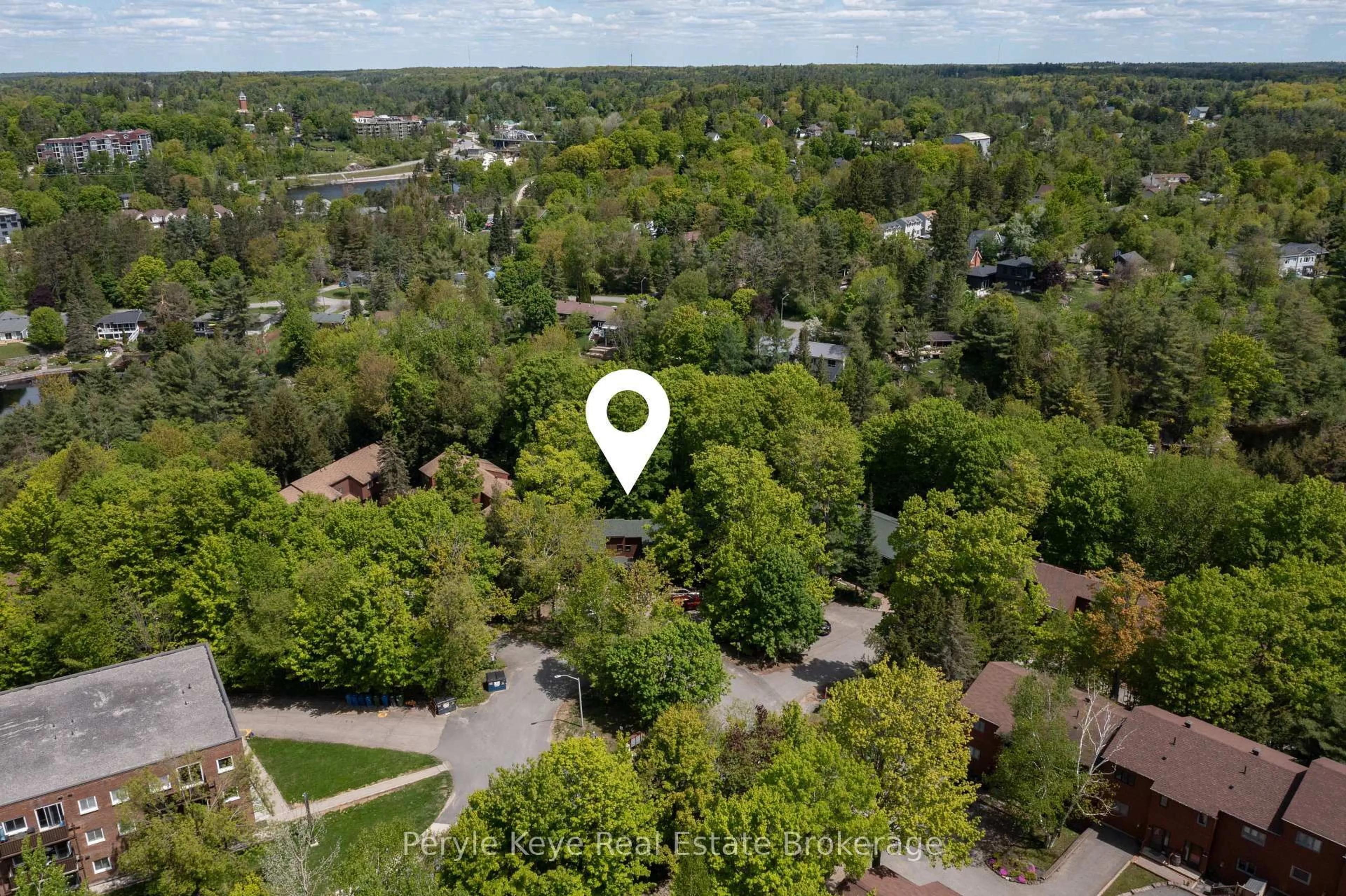 A pic from outside/outdoor area/front of a property/back of a property/a pic from drone, forest/trees view for 63 Southbank Dr #2, Bracebridge Ontario P1L 1G2