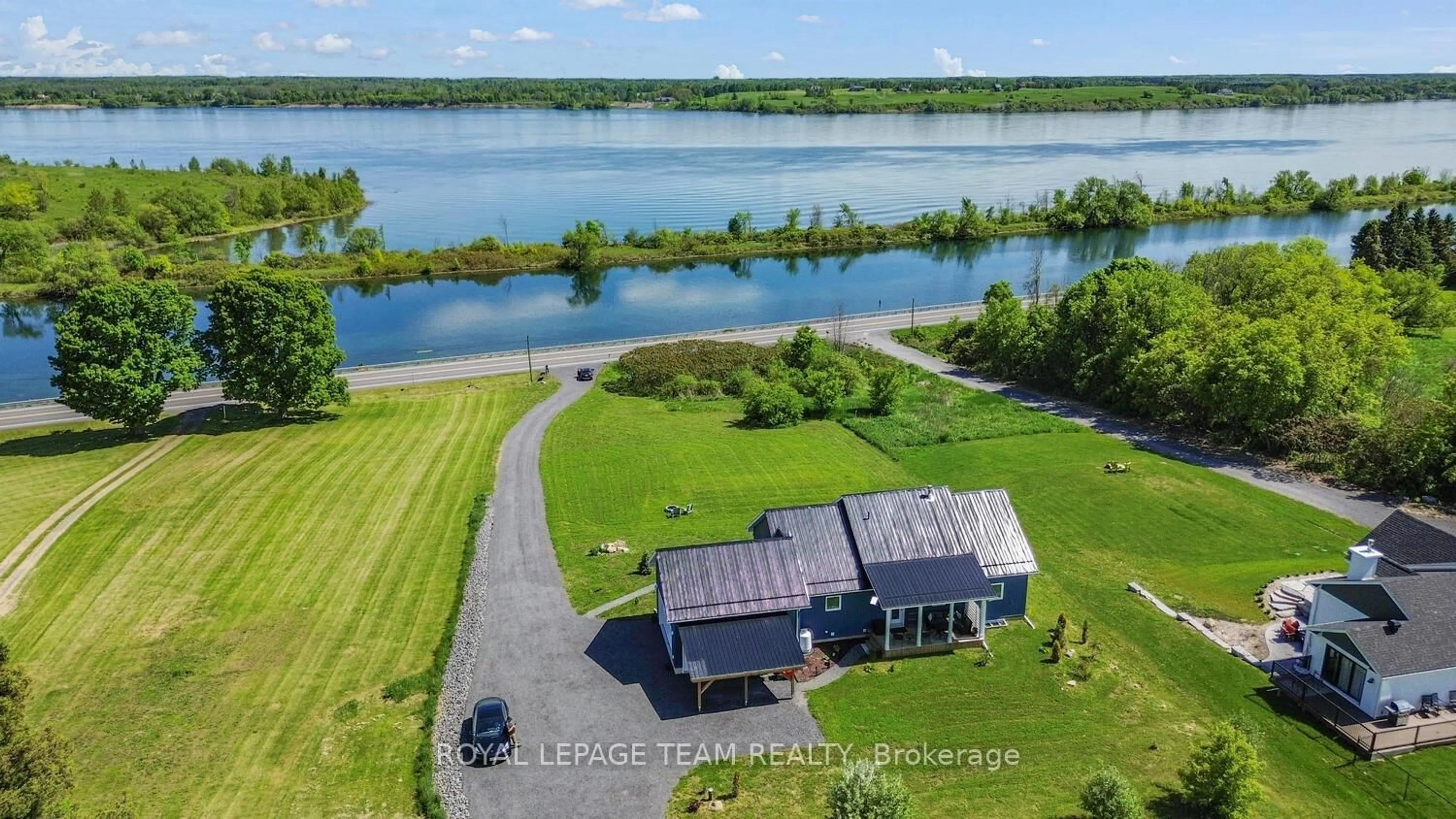 A pic from outside/outdoor area/front of a property/back of a property/a pic from drone, water/lake/river/ocean view for 10249 County 2 Rd, South Dundas Ontario K0E 1K0