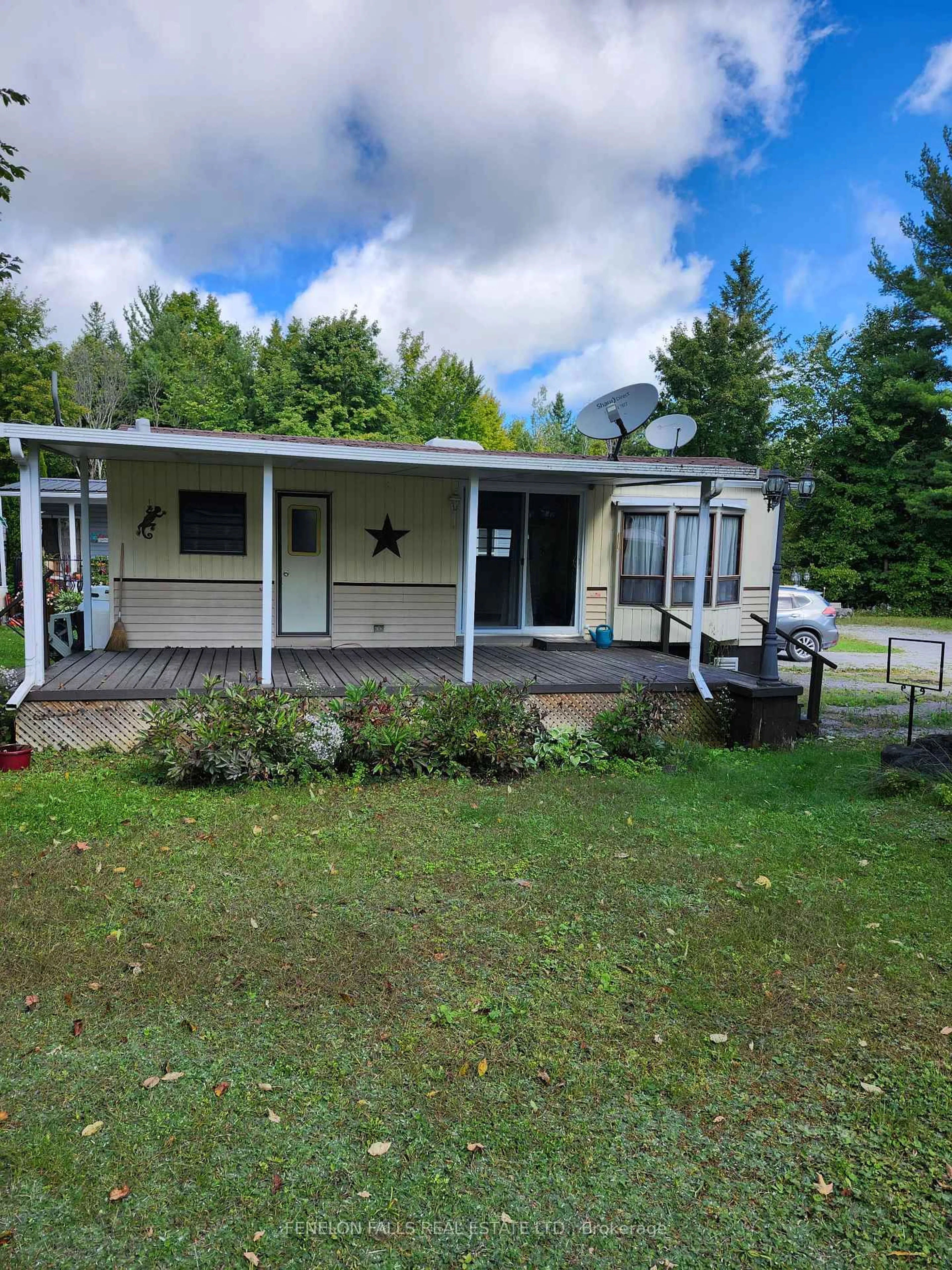 A pic from outside/outdoor area/front of a property/back of a property/a pic from drone, unknown for 1802 County Road 121 Rd #314, Kawartha Lakes Ontario K0M 1N0