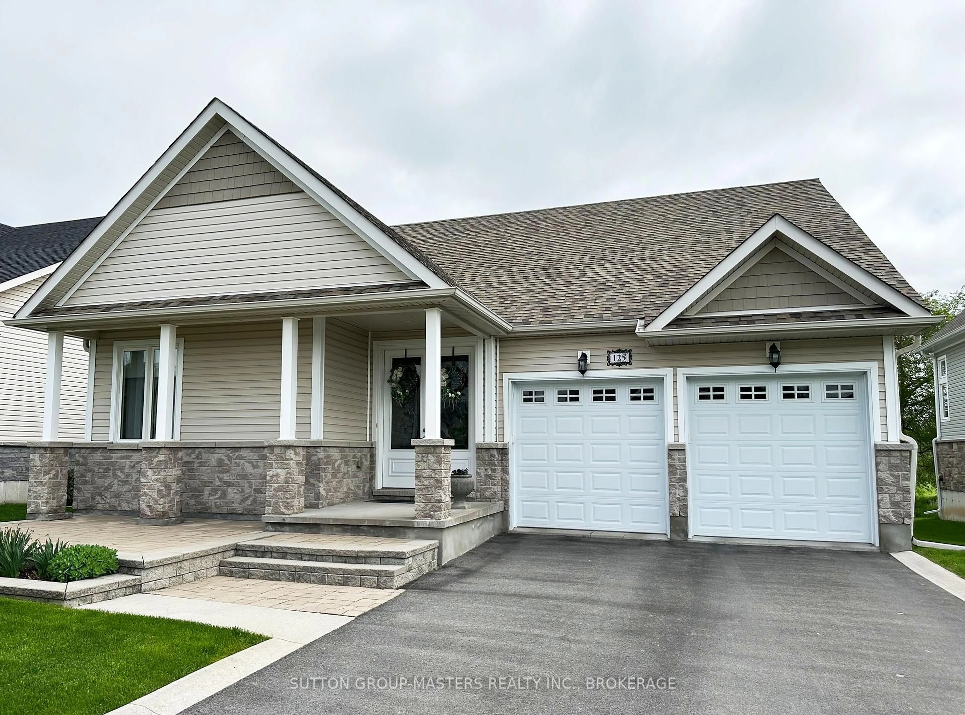 Home with vinyl exterior material, street for 125 Country Club Dr, Bath Ontario K0H 1G0