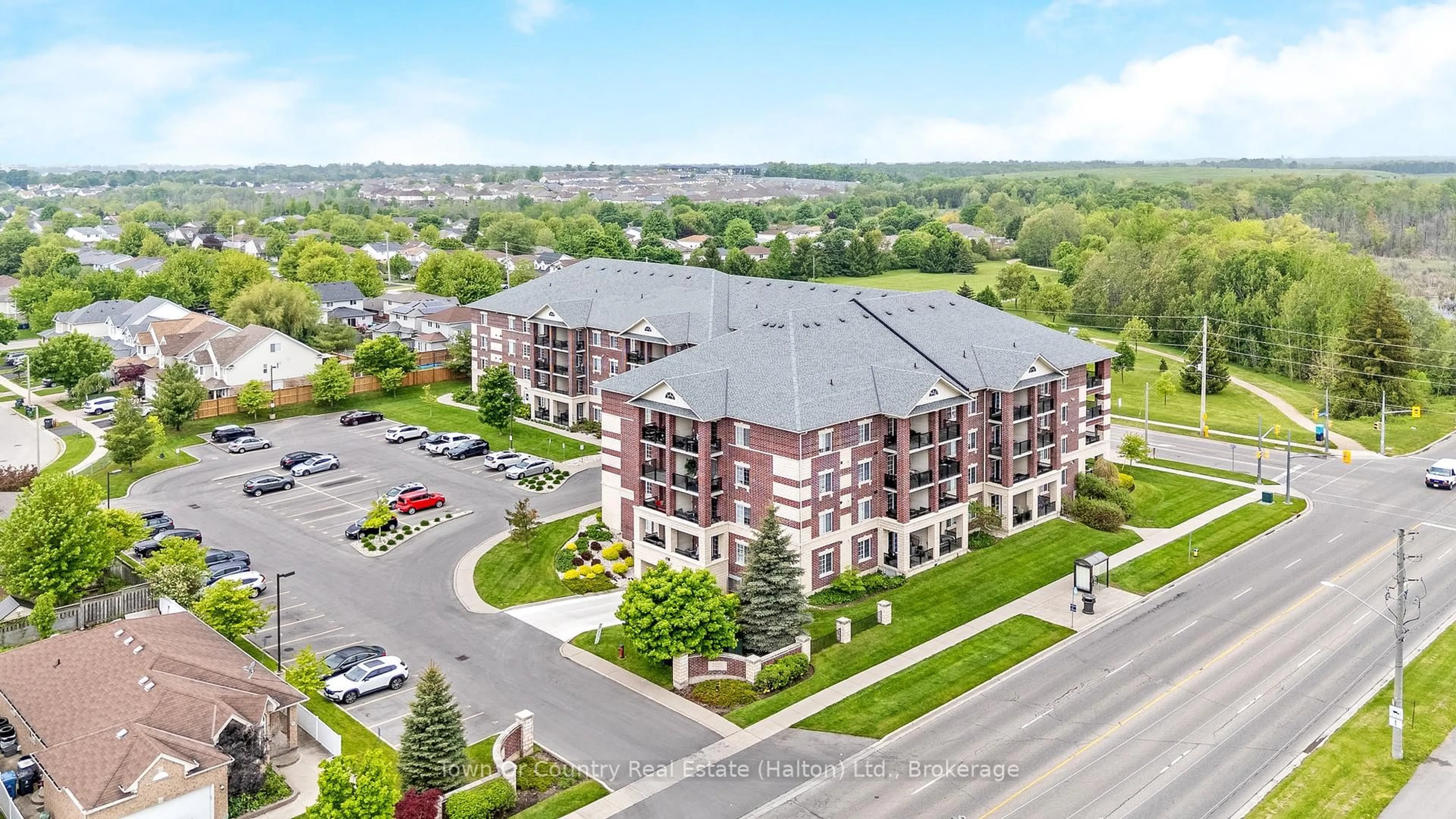 A pic from outside/outdoor area/front of a property/back of a property/a pic from drone, building for 308 Watson Pkwy #311, Guelph Ontario N1E 0G7