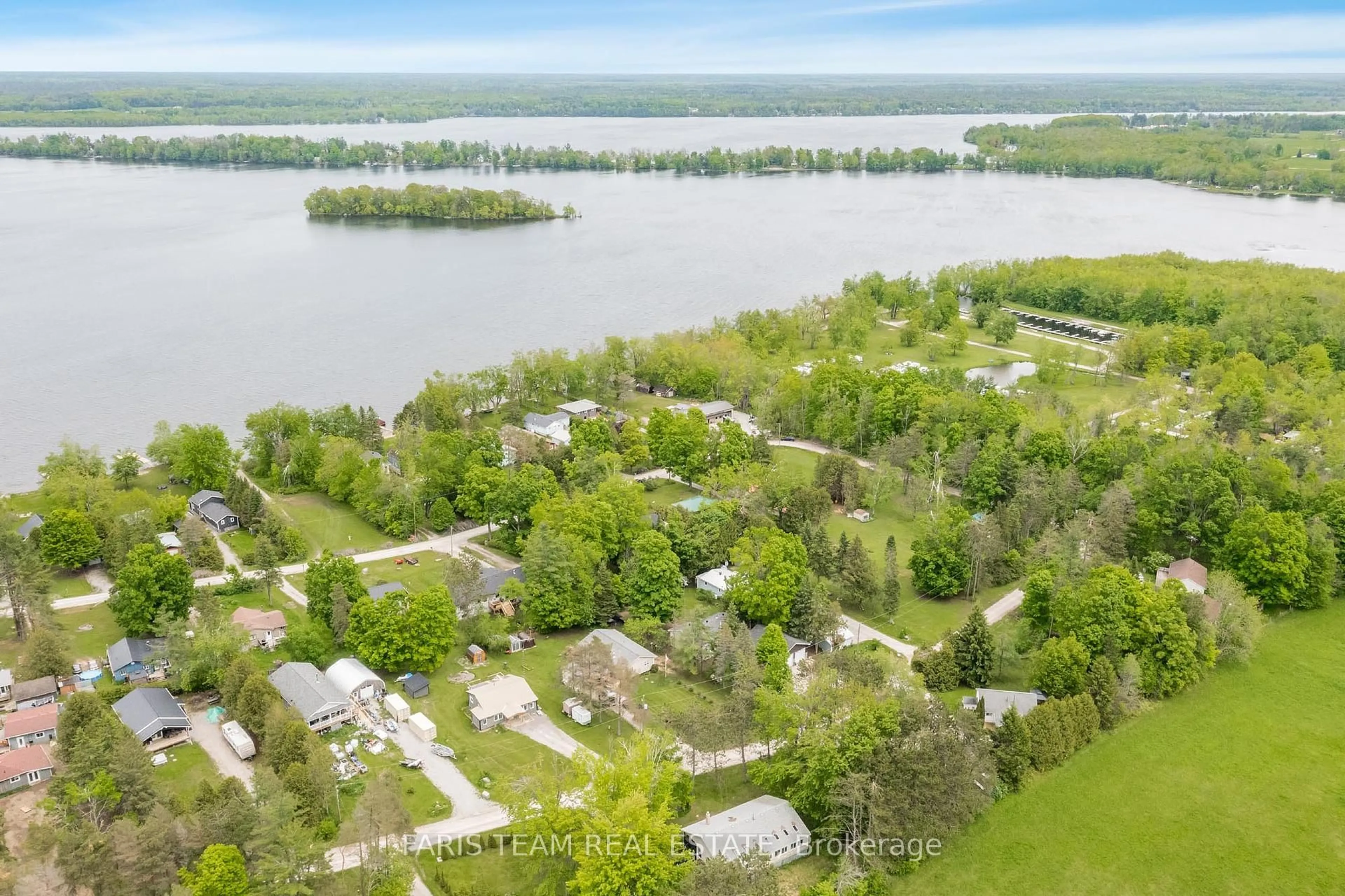 A pic from outside/outdoor area/front of a property/back of a property/a pic from drone, water/lake/river/ocean view for 85 Fulsom Cres, Kawartha Lakes Ontario L3V 6H5