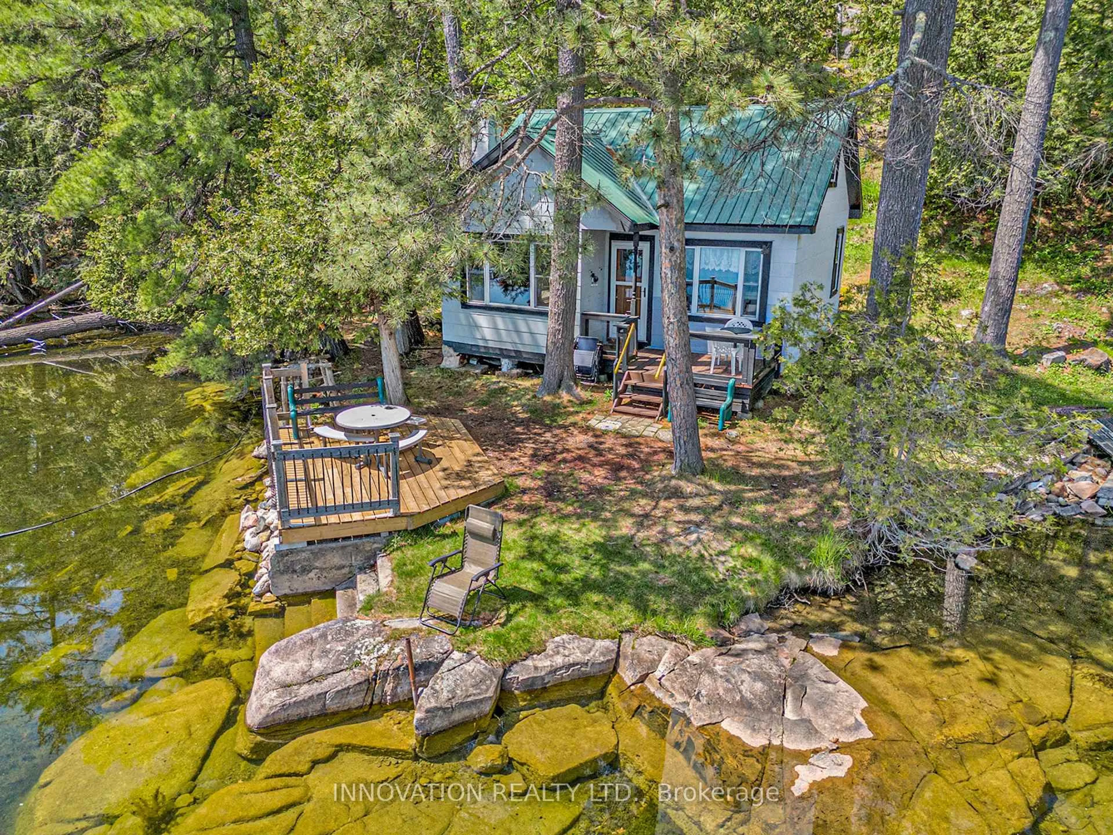 A pic from outside/outdoor area/front of a property/back of a property/a pic from drone, water/lake/river/ocean view for 1257 Harding Lane, Sharbot Lake Ontario K0H 2P0